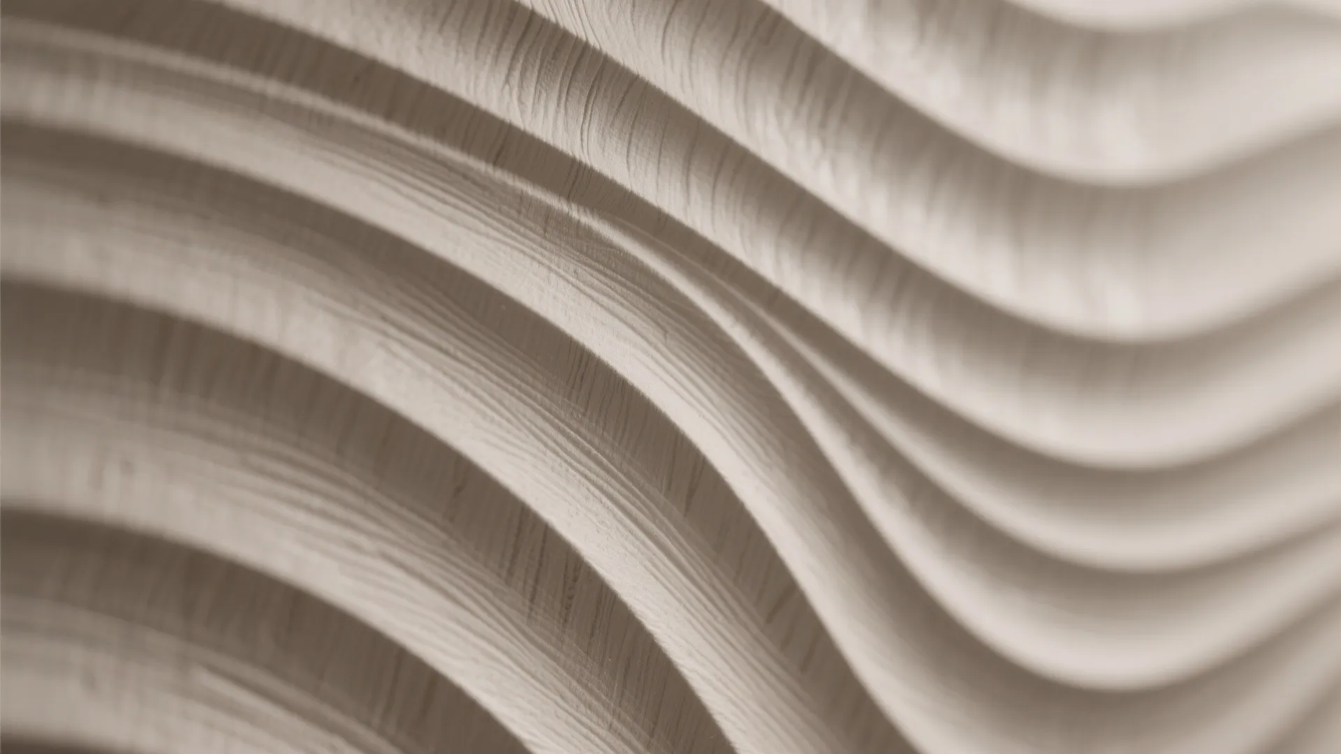 Close up of a beige wall panel with wavy lines and smooth wood grain texture surface