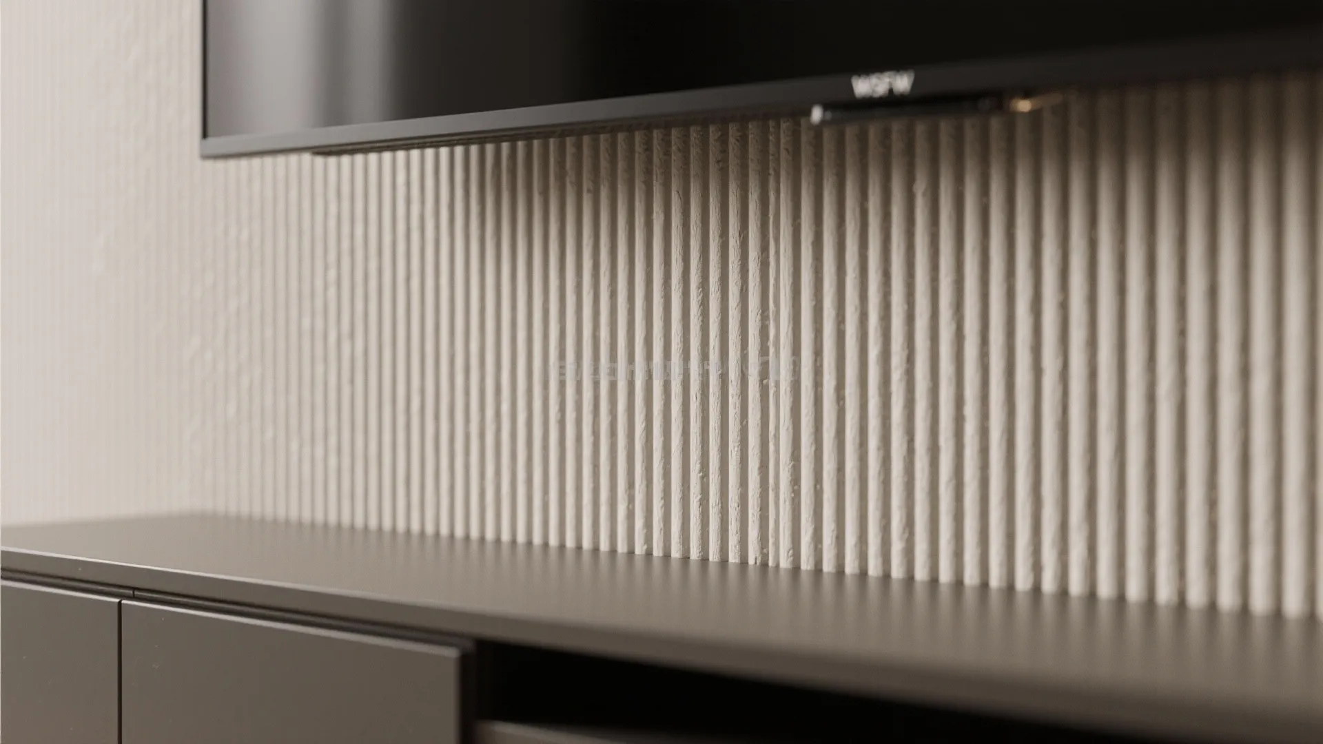 Close up of a textured wall panel with vertical stripes behind a dark grey cabinet