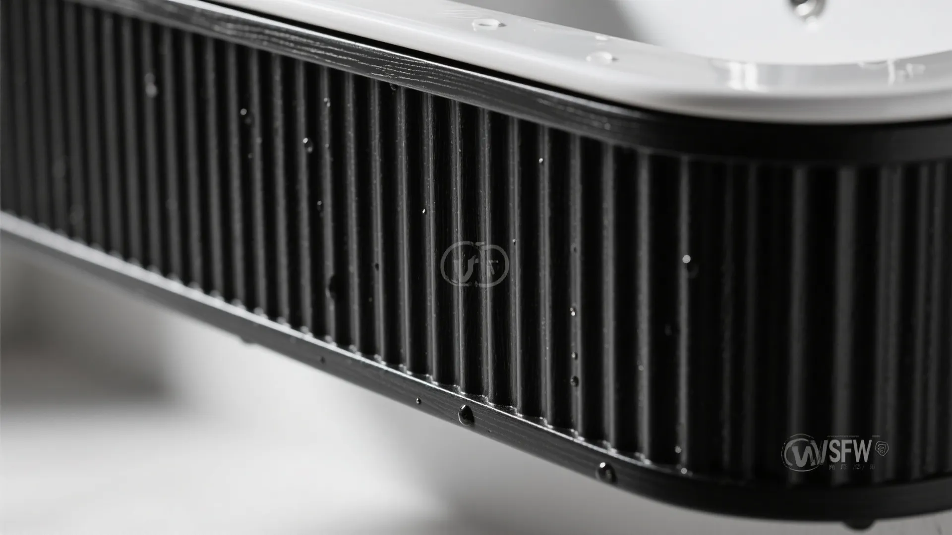 4) Black vanity with fluted texture and integrated sink