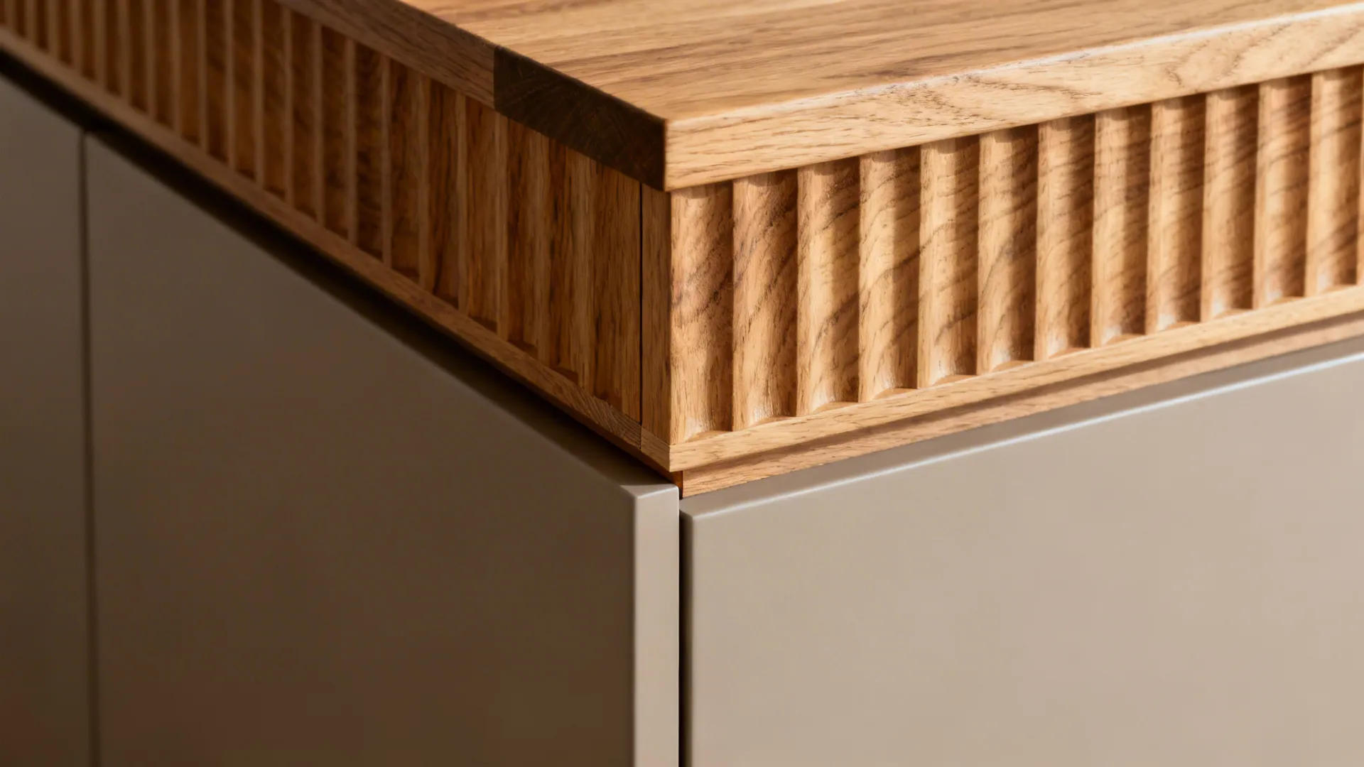 Macro of a fluted oak panel meeting a matte cabinet with crisp joinery.