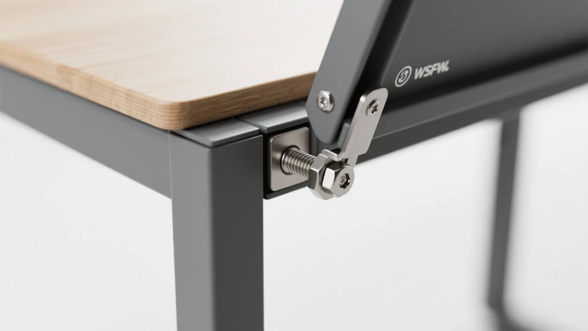 Macro of a fold-down balcony table hinge with powder-coated aluminum and stainless hardware.