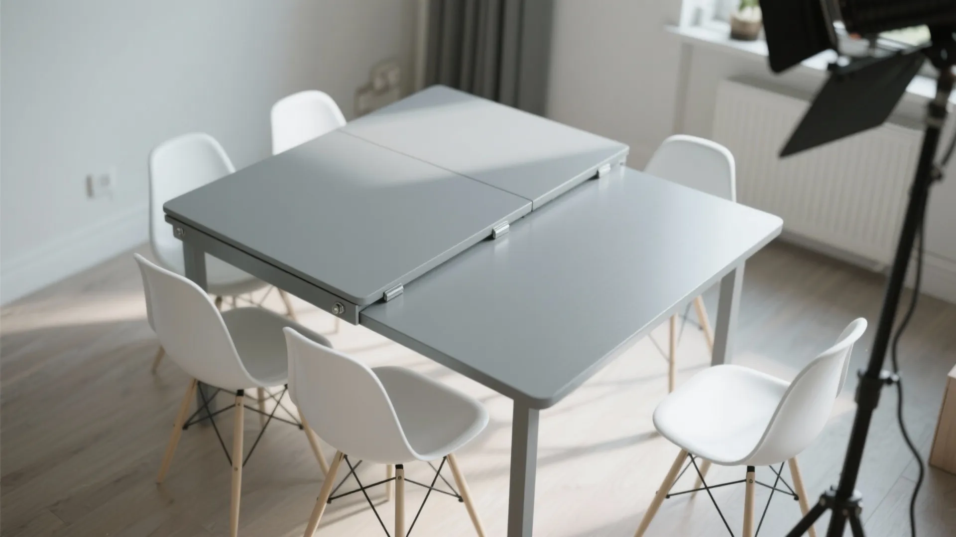 4. Foldable grey leaf table with white folding chairs