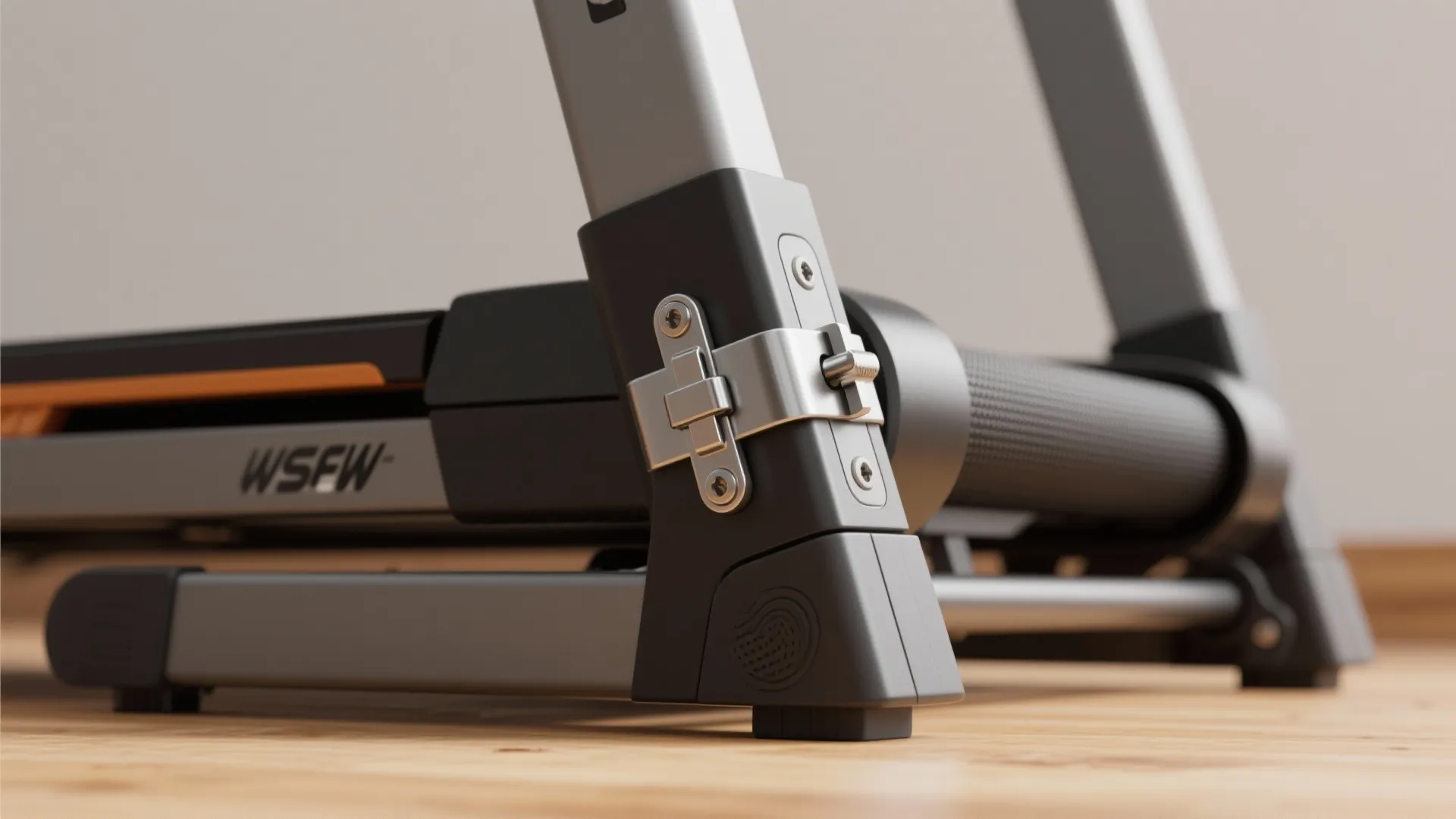 Close up view of a metal hinge and locking mechanism on a grey foldable treadmill