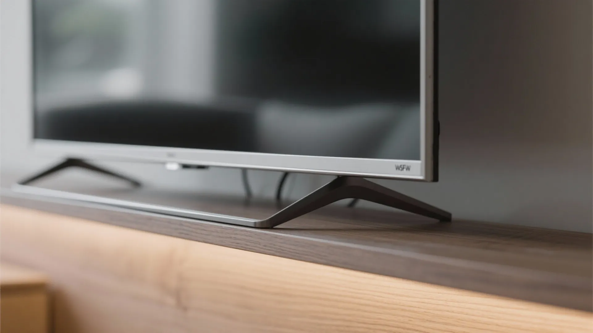 3) Framed TV with art-mode display and asymmetrical shelving