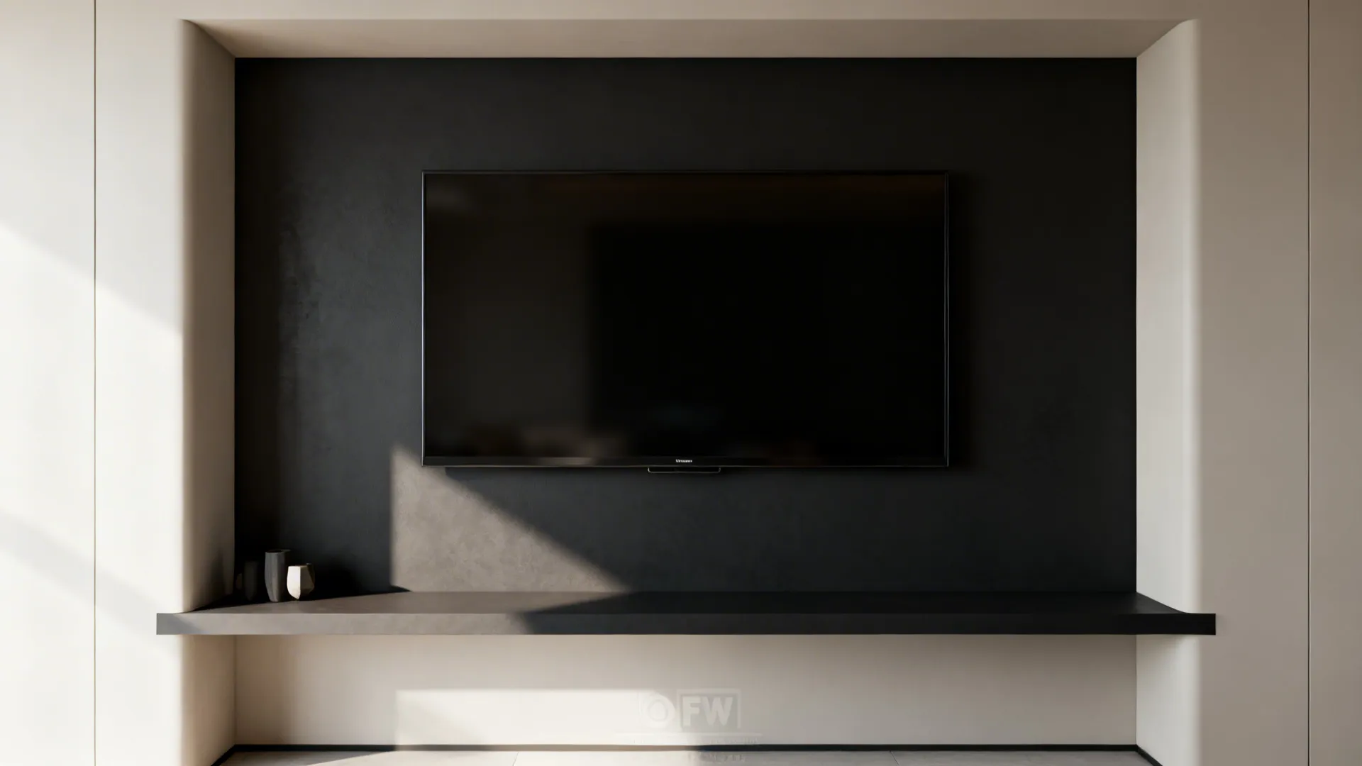 Framed TV nook with matte dark interior paint and a light surround, mounted TV and floating shelf.