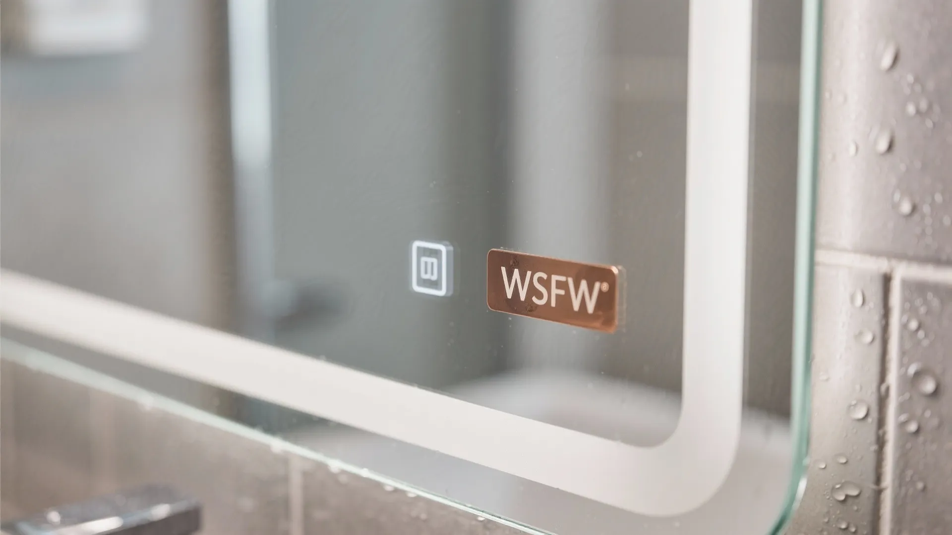 Macro detail of a frameless mirror edge with clean seal and anti-corrosion backing.