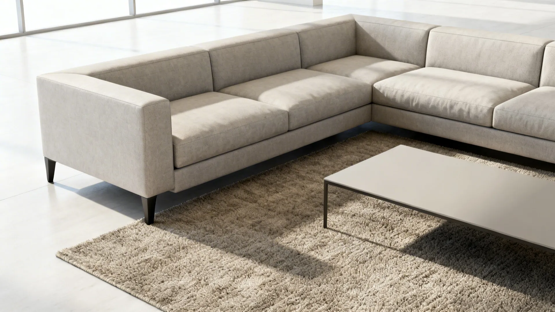 Sectional with only front legs on the rug, creating an open yet intentional seating area.