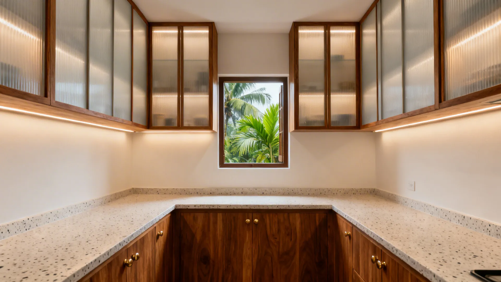 Galley kitchen with frosted glass cabinet shutters in slim teak frames and warm LED lighting.