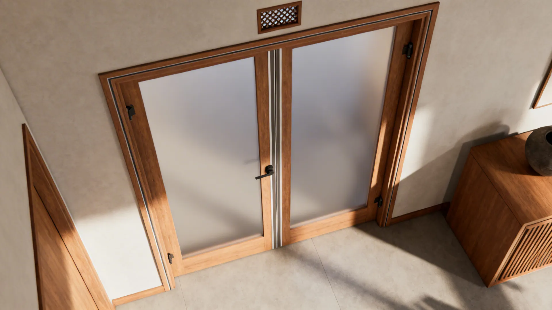 Top-down view showing frosted double doors with wood frame, astragal strip, and top vent.
