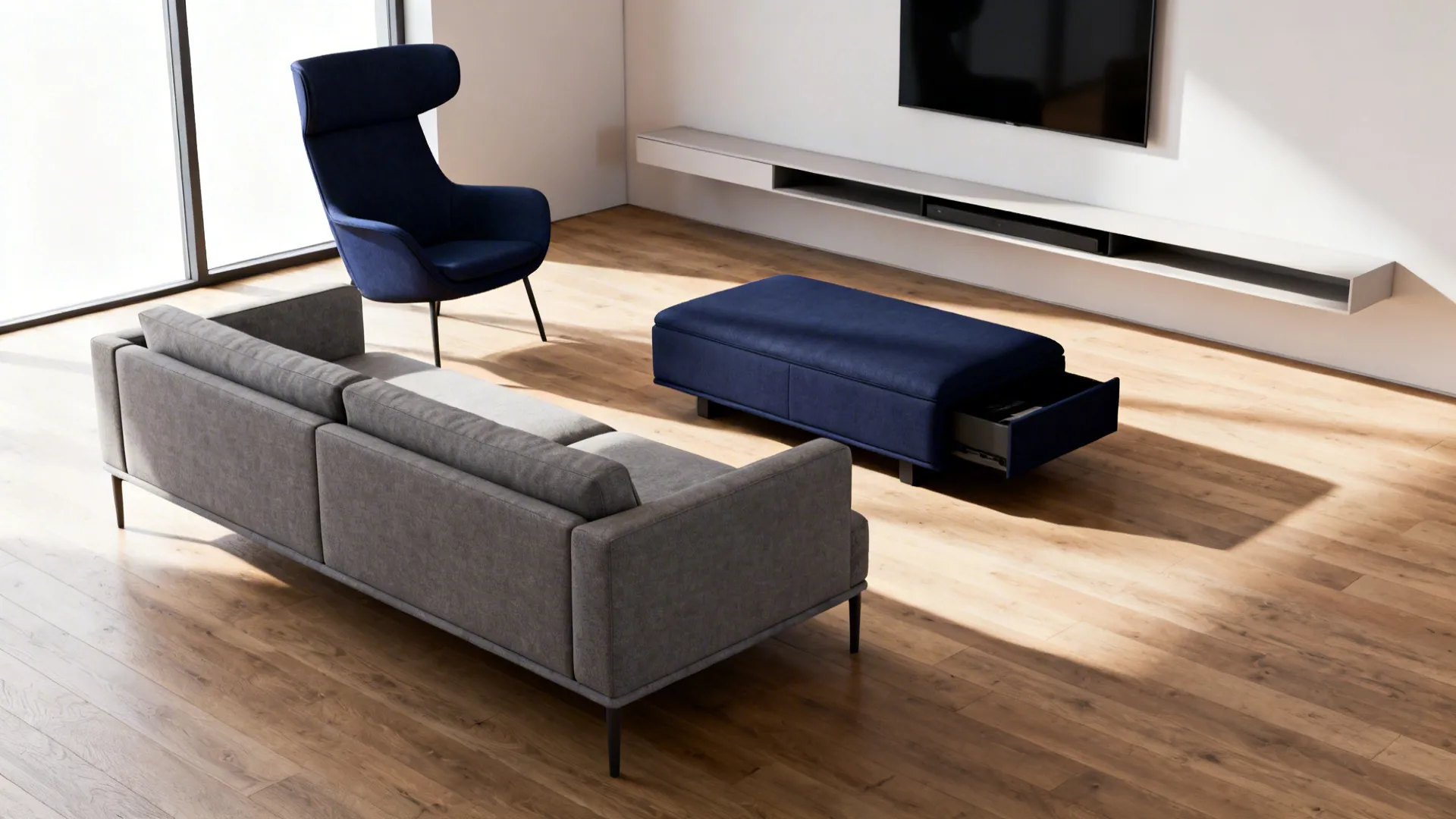 Living room layout with low grey sofa, navy accent chair, navy ottoman with hidden storage and floating arrangement.