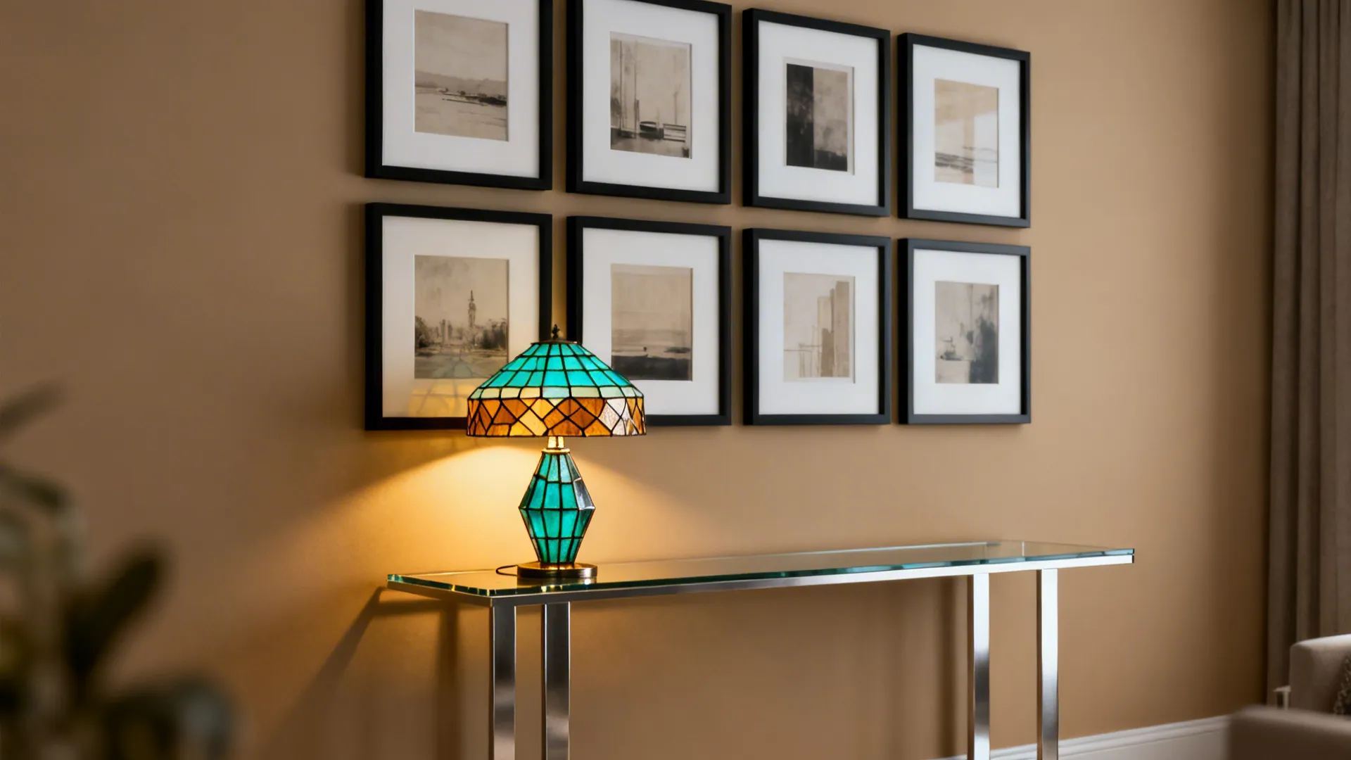 Console table under a gallery wall with a Tiffany lamp adding warm accent light and color balance.