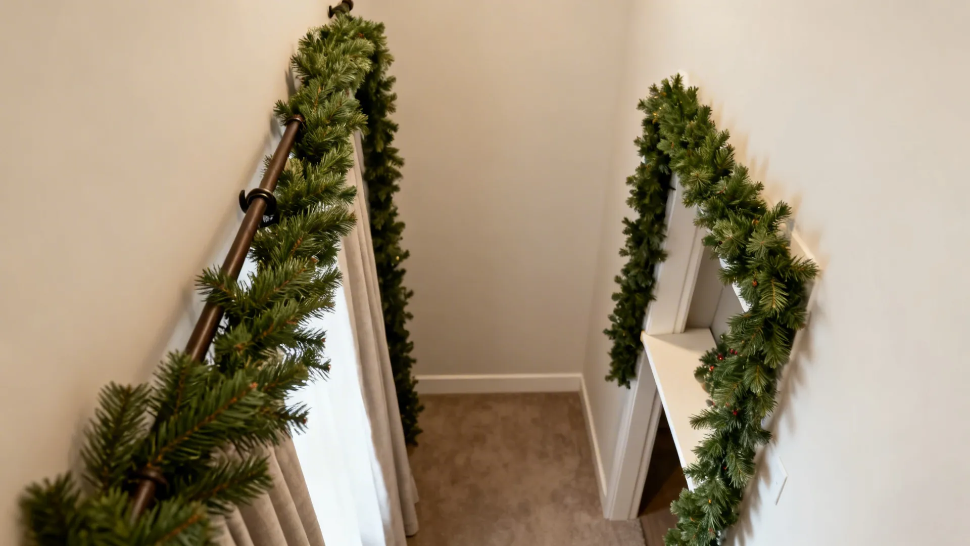 Top-down of faux swag looped on a curtain rod and garland framing a shelf in a small apartment