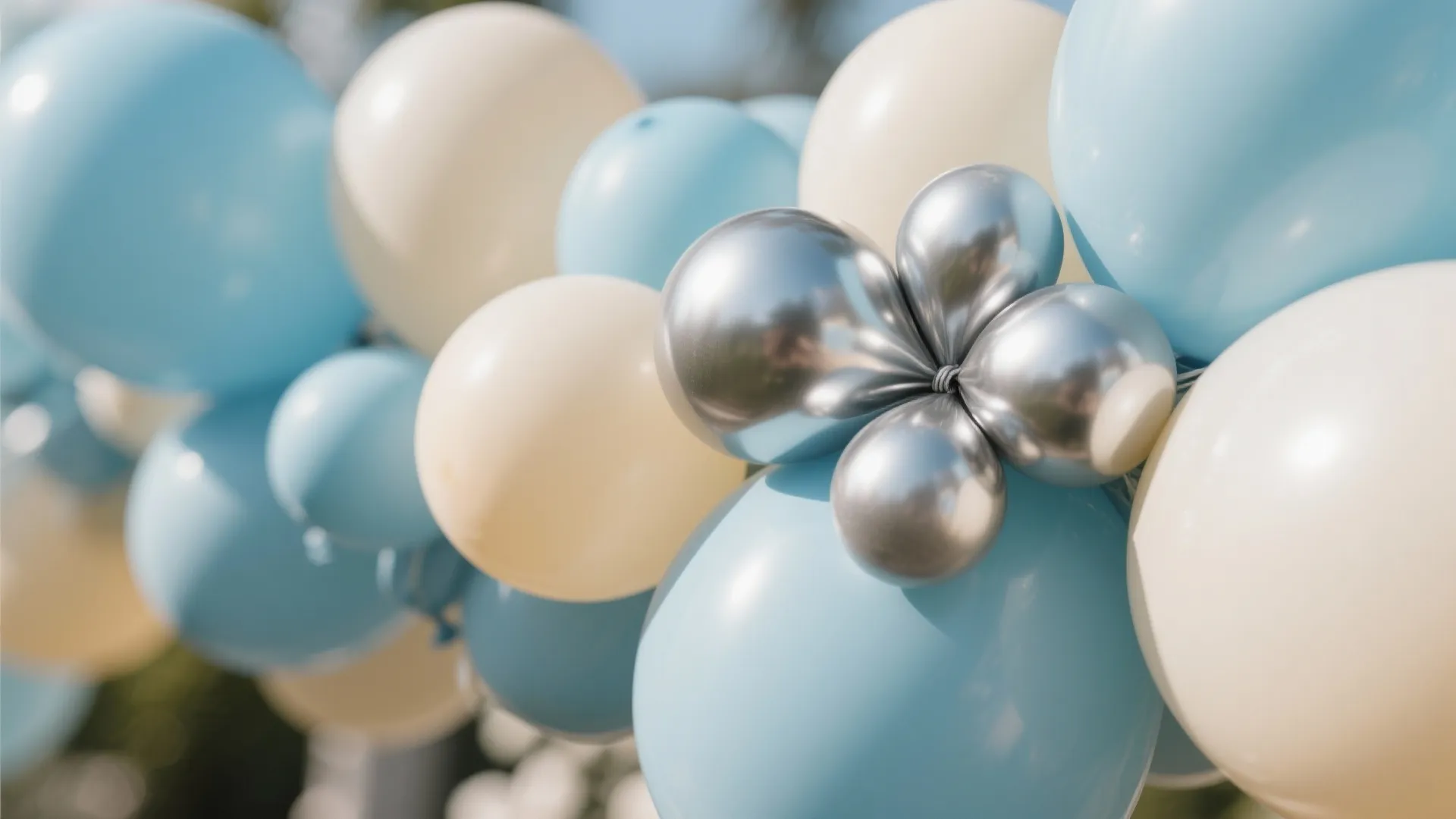 Soft Blue Organic Balloon Garland over the Dessert Table