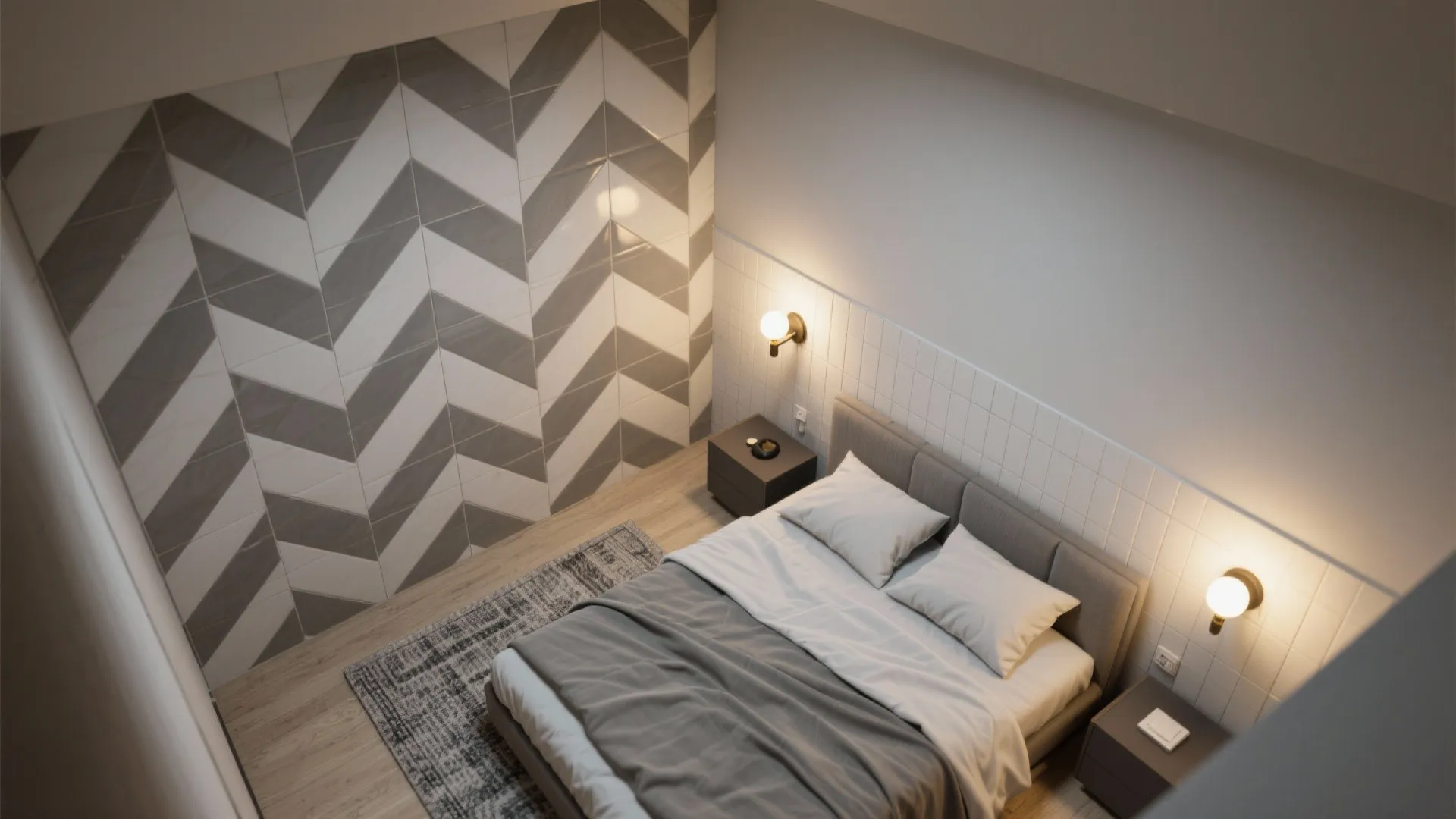 Top view of bedroom showing grey bed, pattern wall tiles, wooden floor, and two wall lights