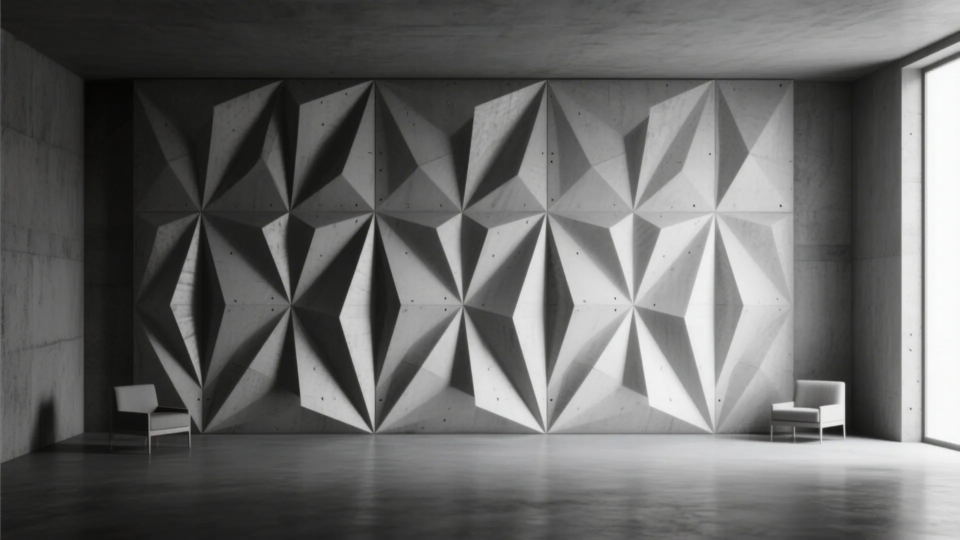 Monochrome geometric 3D cement wall panels casting strong light and shadow