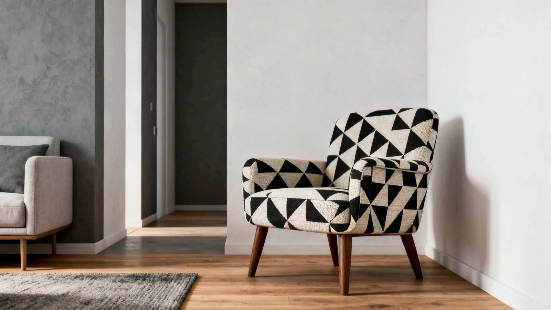 Small modern living room with a mid-century geometric patterned accent chair as focal point.