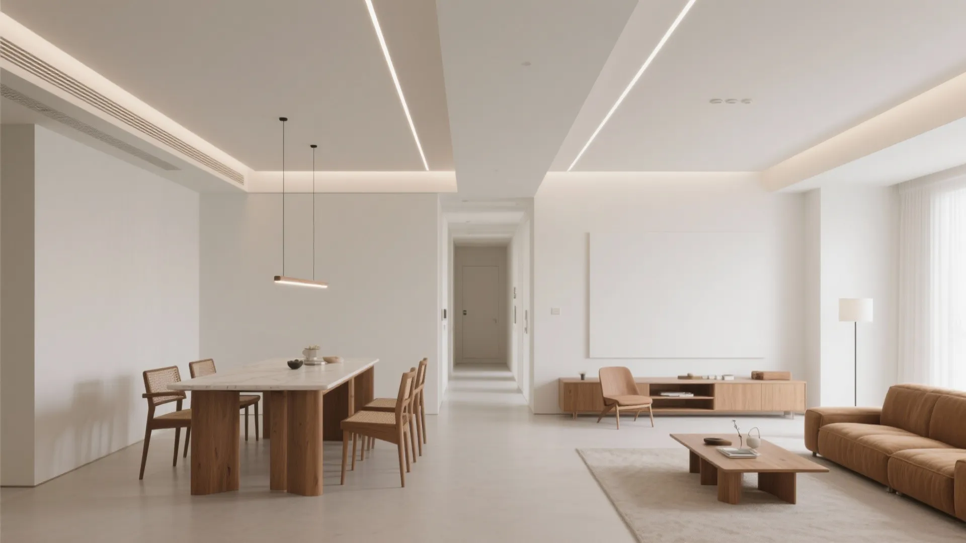 Minimalist open plan room with wooden dining table and brown sofa under linear ceiling lights