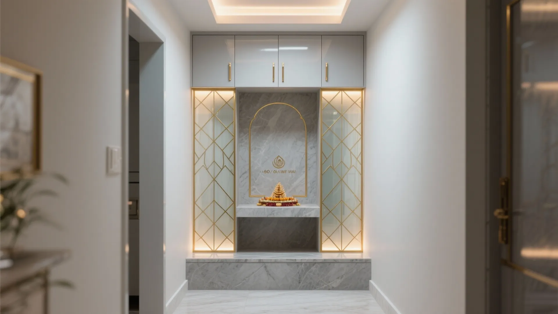 Geometric frosted glass with slim brass trims screens a compact pooja corner in a hallway recess.