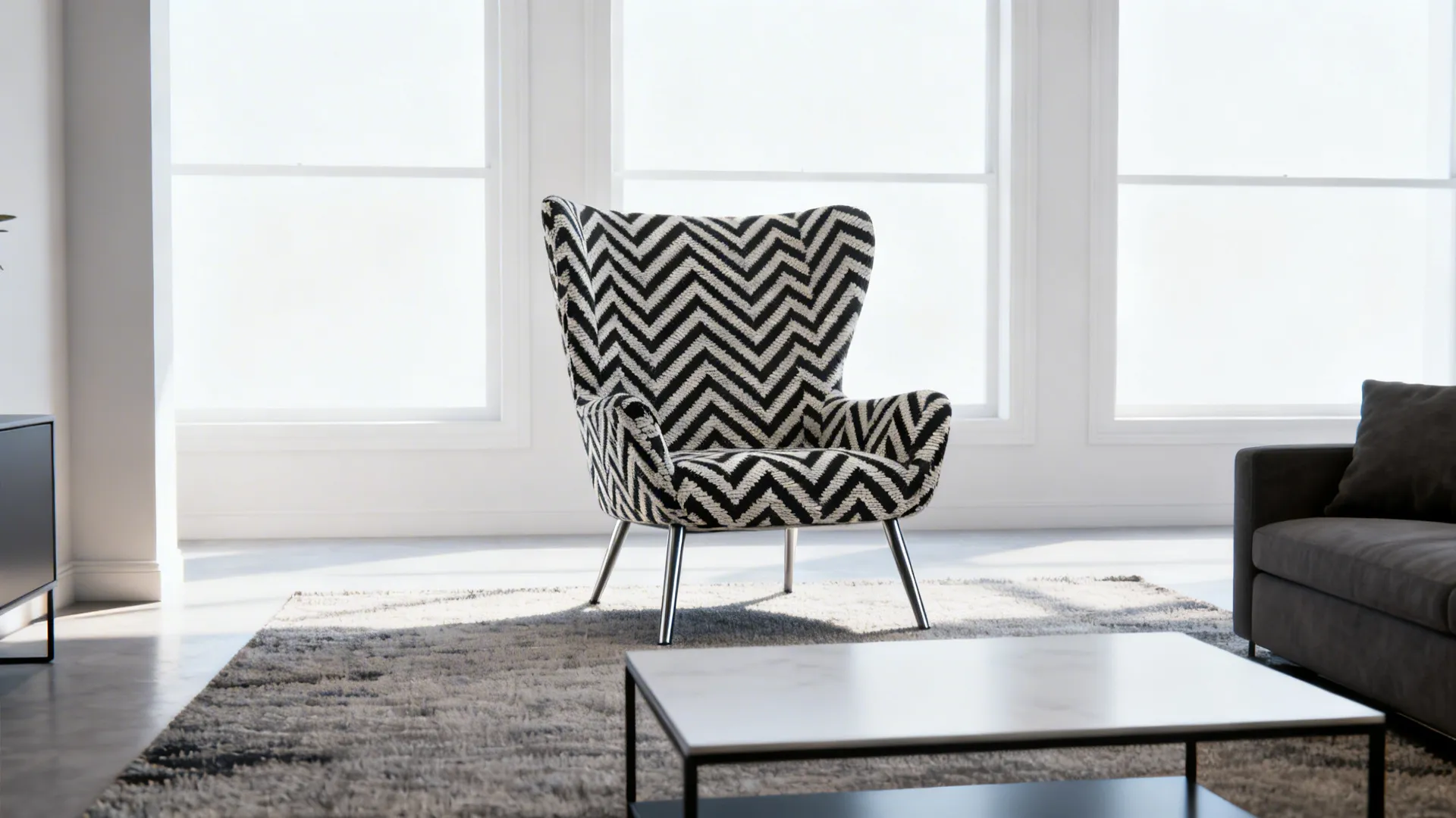Minimalist studio living room with a bold chevron-print accent chair anchoring the area