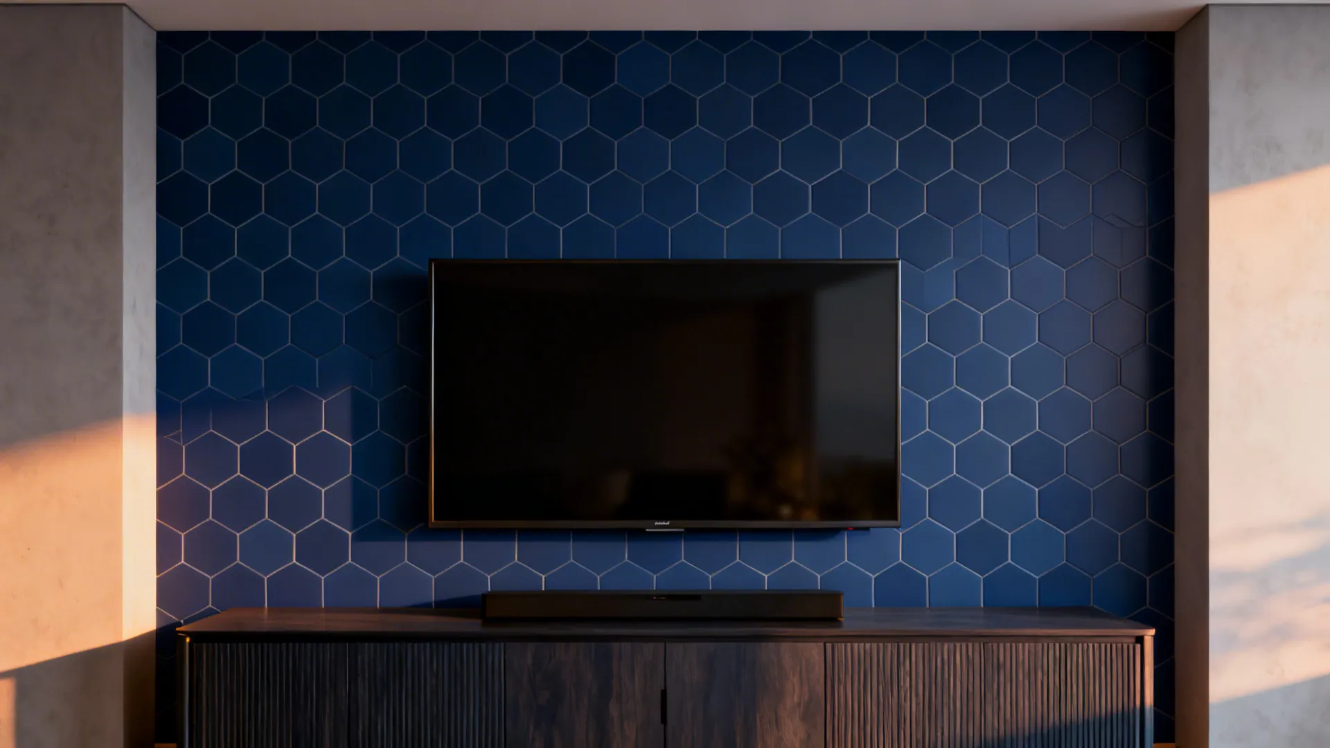 Media wall with midnight-blue hex tile peel-and-stick wallpaper behind a TV and media cabinet, matte finish to reduce glare.