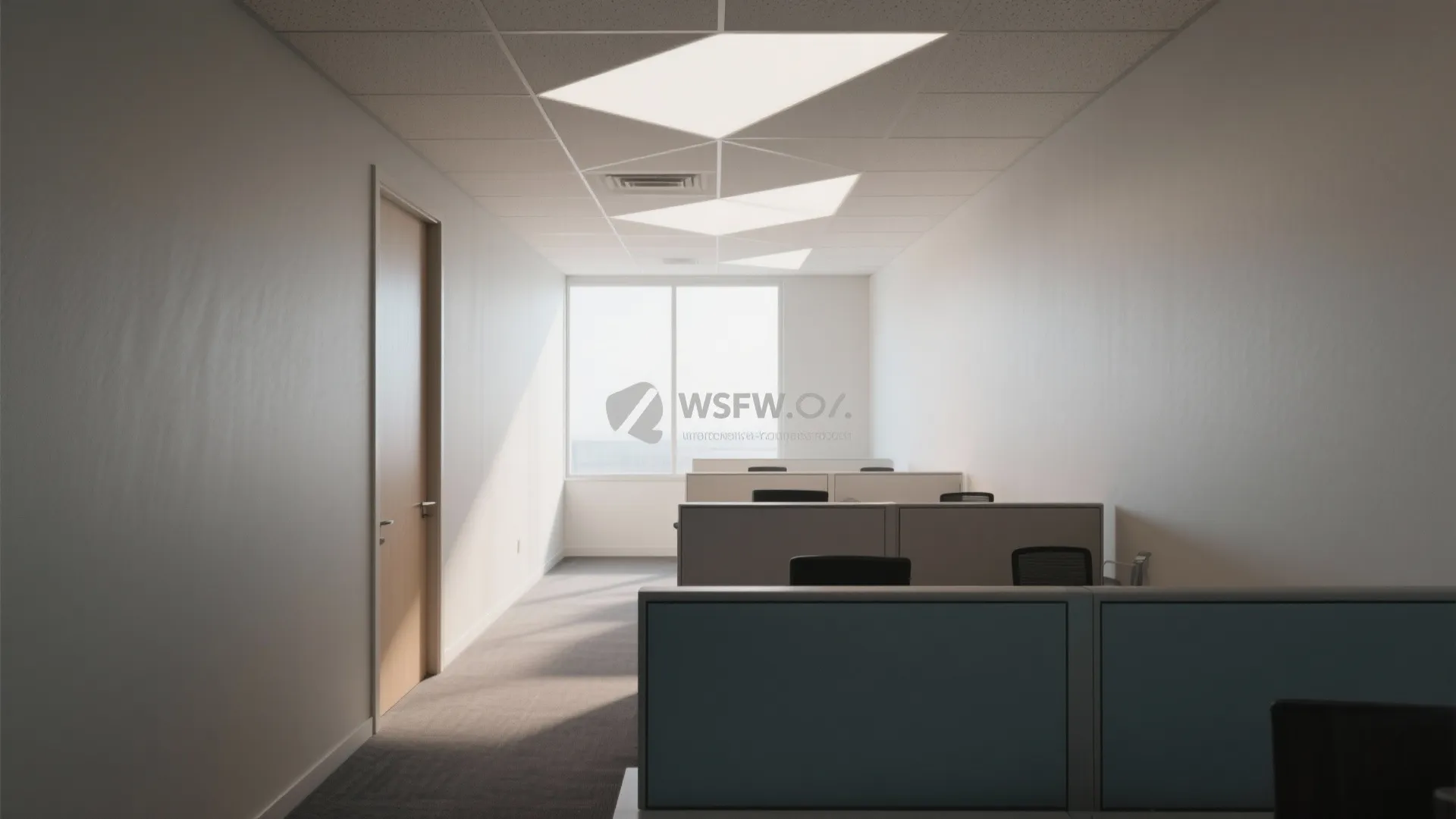 Bright office space with rows of desks and a unique geometric recessed ceiling light design