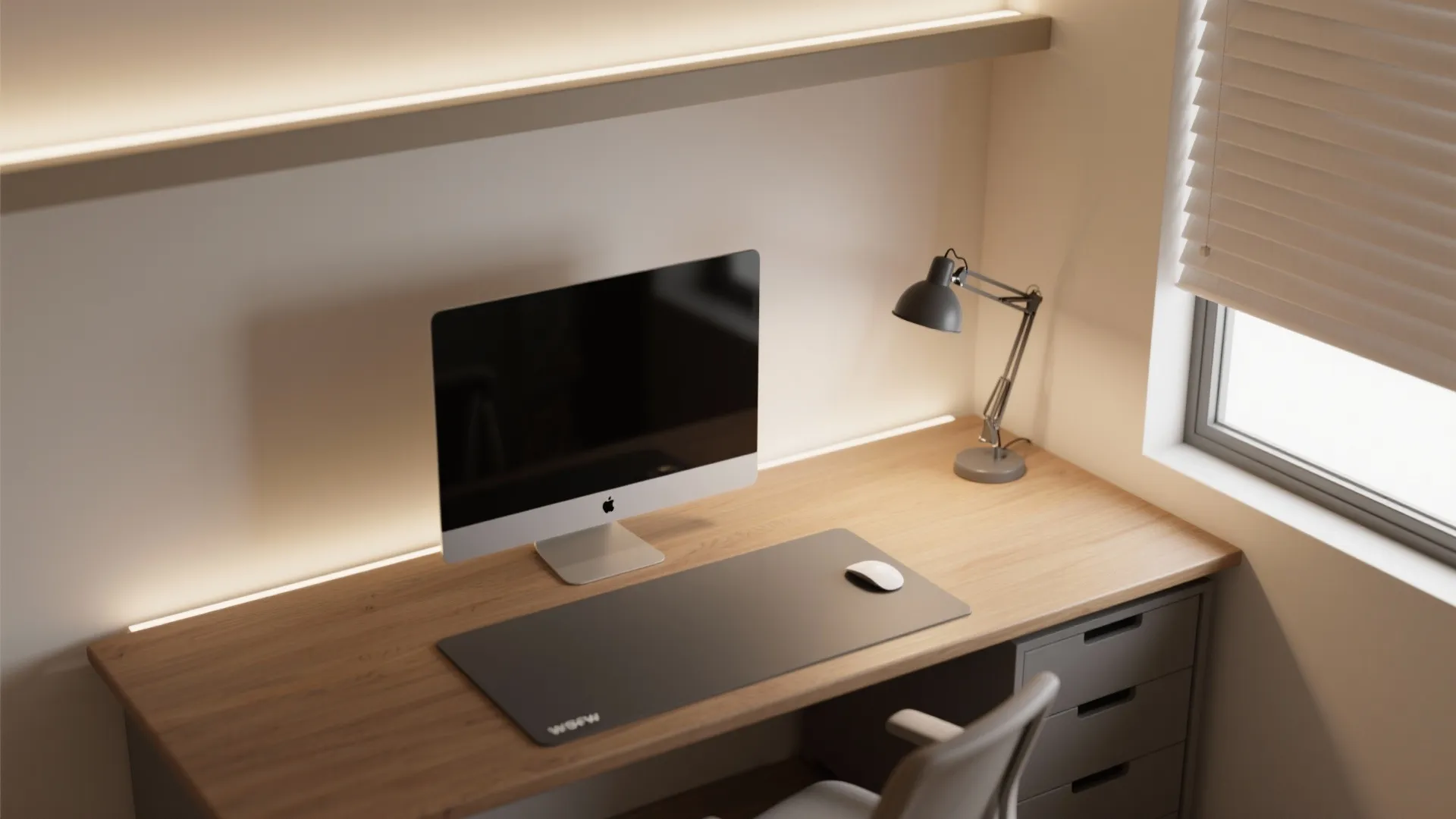 Modern home office desk with computer monitor black desk mat small lamp and hidden shelf lighting