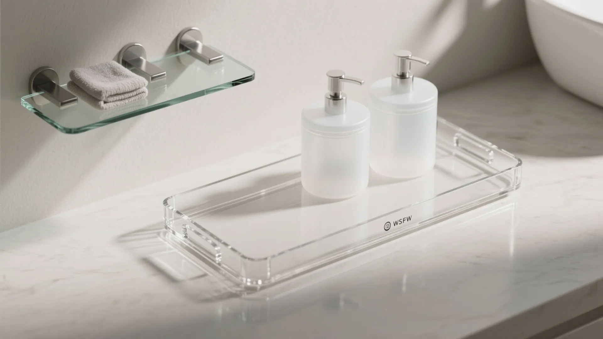 Clear tray on a marble counter with two white soap bottles and a glass wall shelf