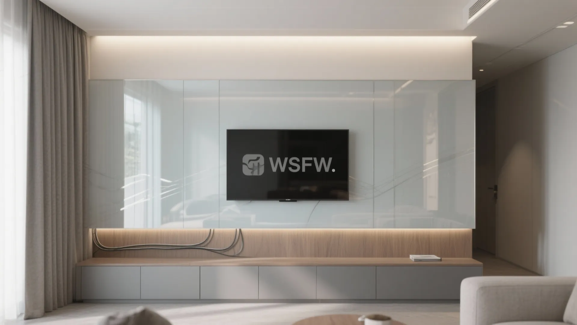 Modern living room with a wall mounted television on a glass panel and grey storage cabinet
