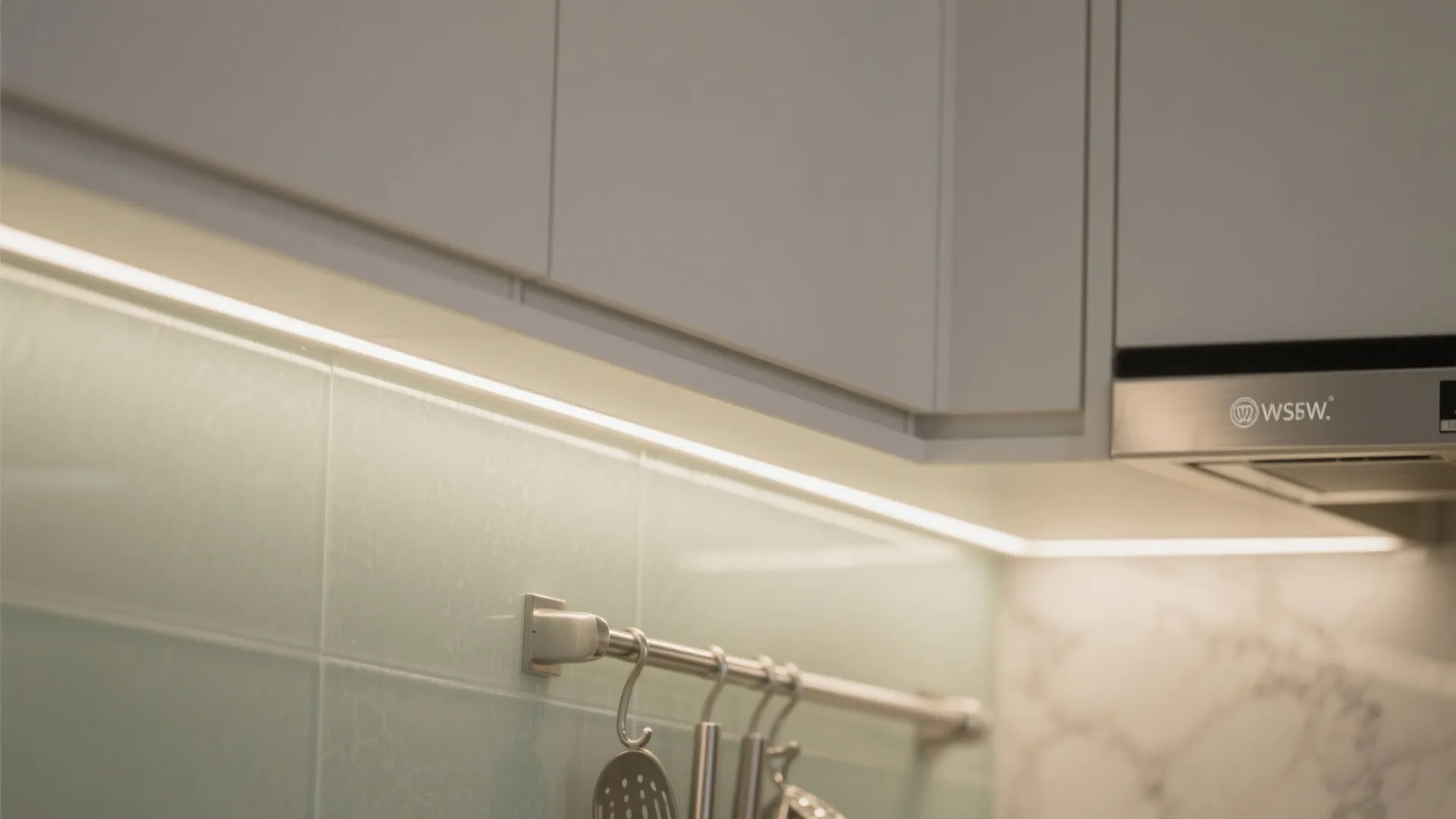 4) Reflective finishes and a glass backsplash to amplify light