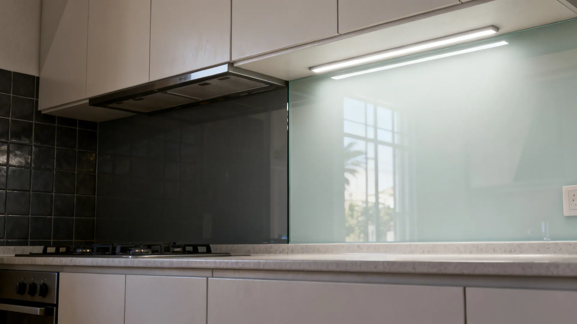 Comparison of dark tile backsplash and bright glass backsplash with under-cabinet LEDs.