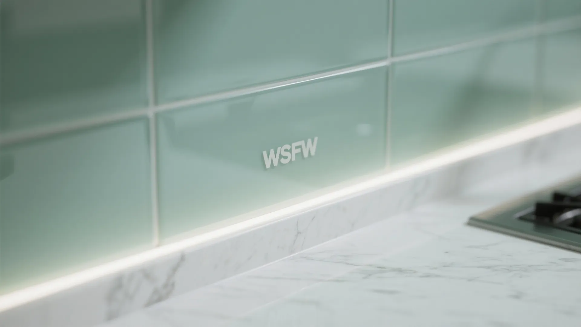 Glass Backsplash and Light Play in a Compact Kitchen
