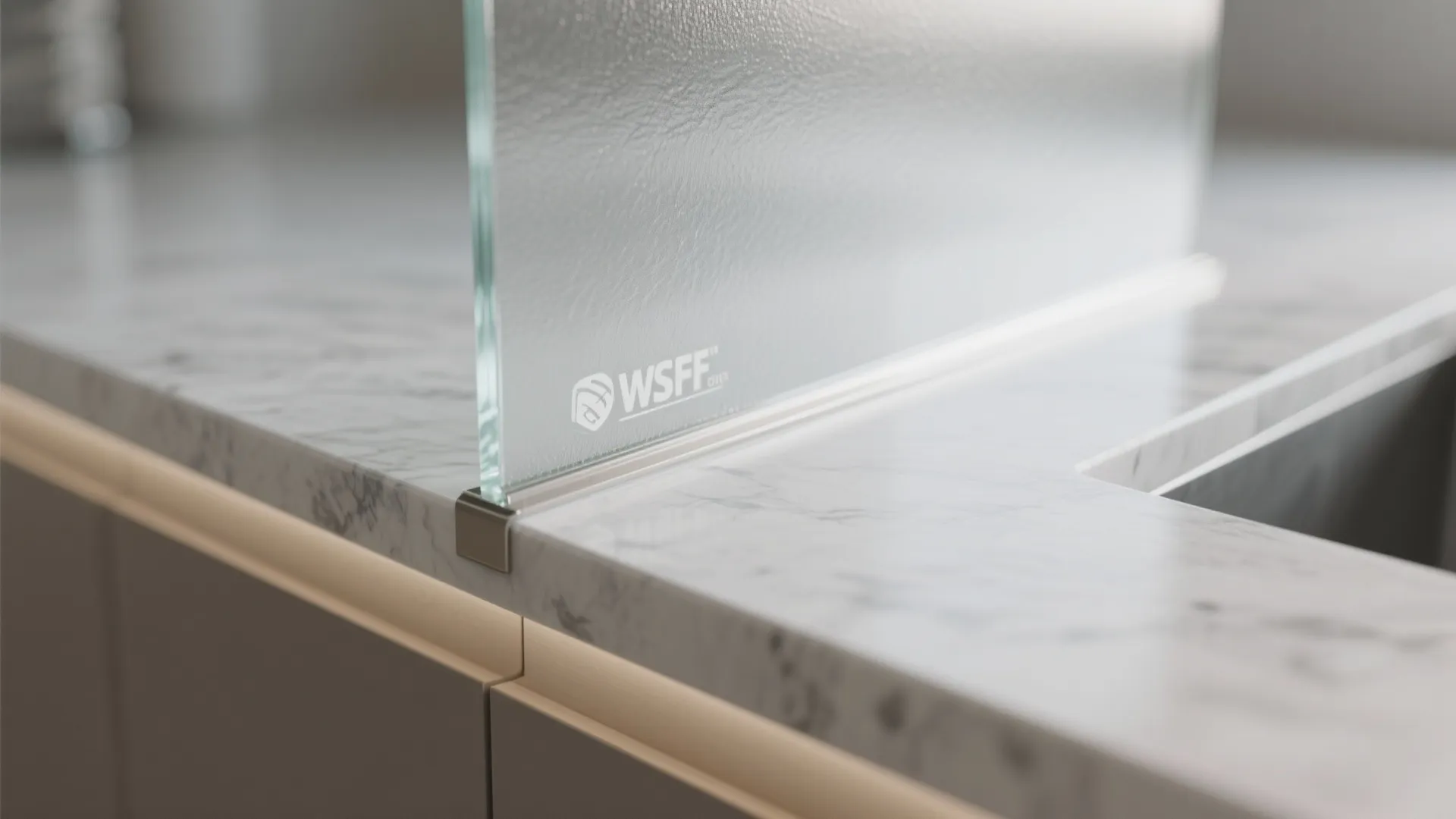 Glass wall panel installed on a marble countertop with soft lighting in a modern kitchen design