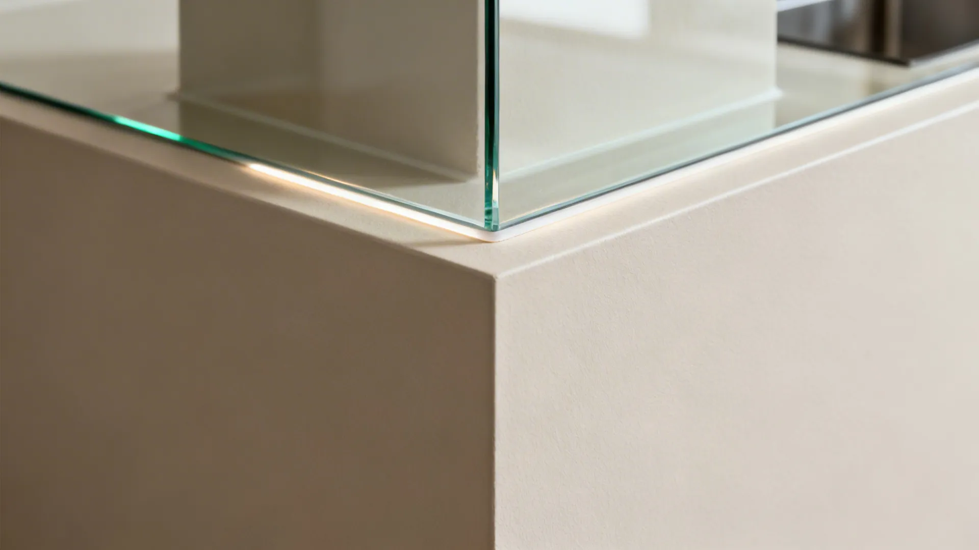 Close up of a glass panel corner on a white cabinet with thin glowing light