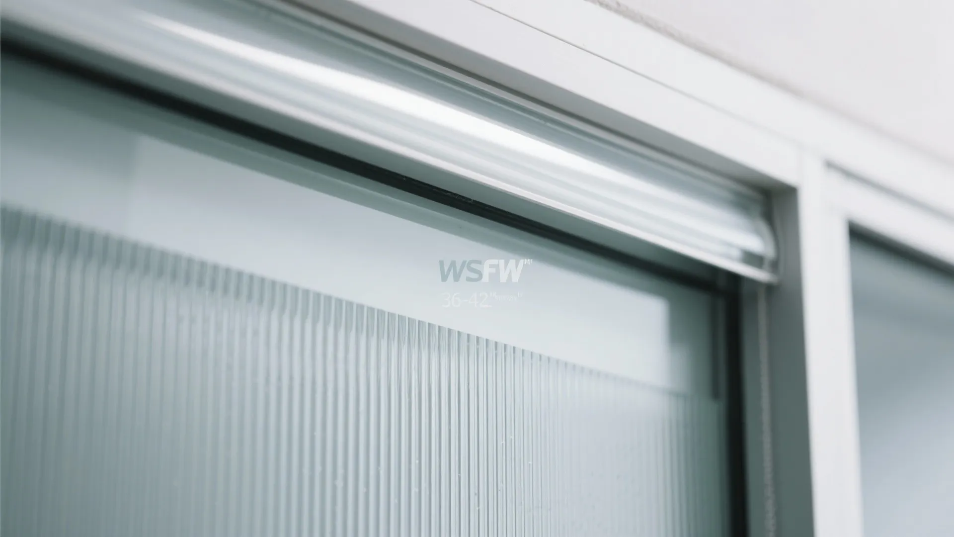 Close up of fluted glass panel with white frame in a modern bright room interior design