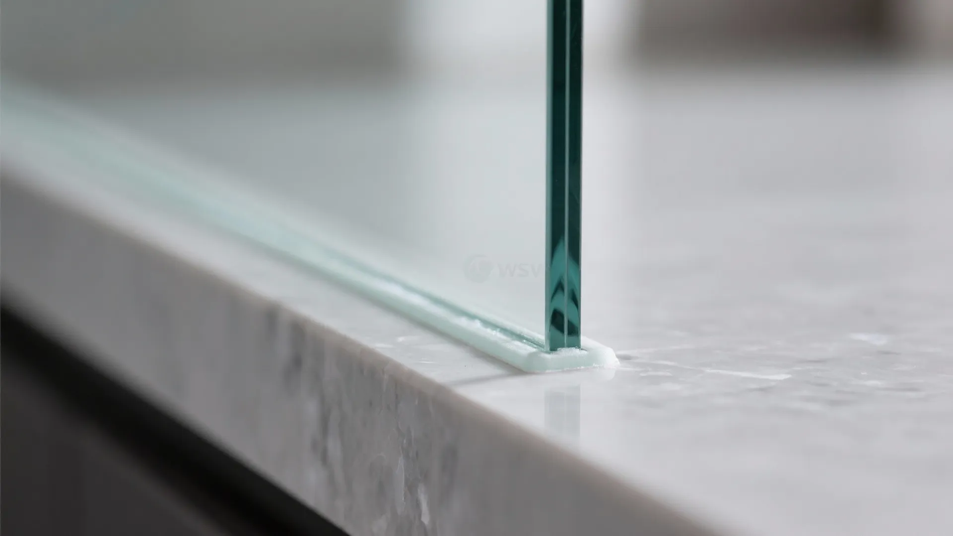 Glass backsplash for borrowed light and easy clean-ups