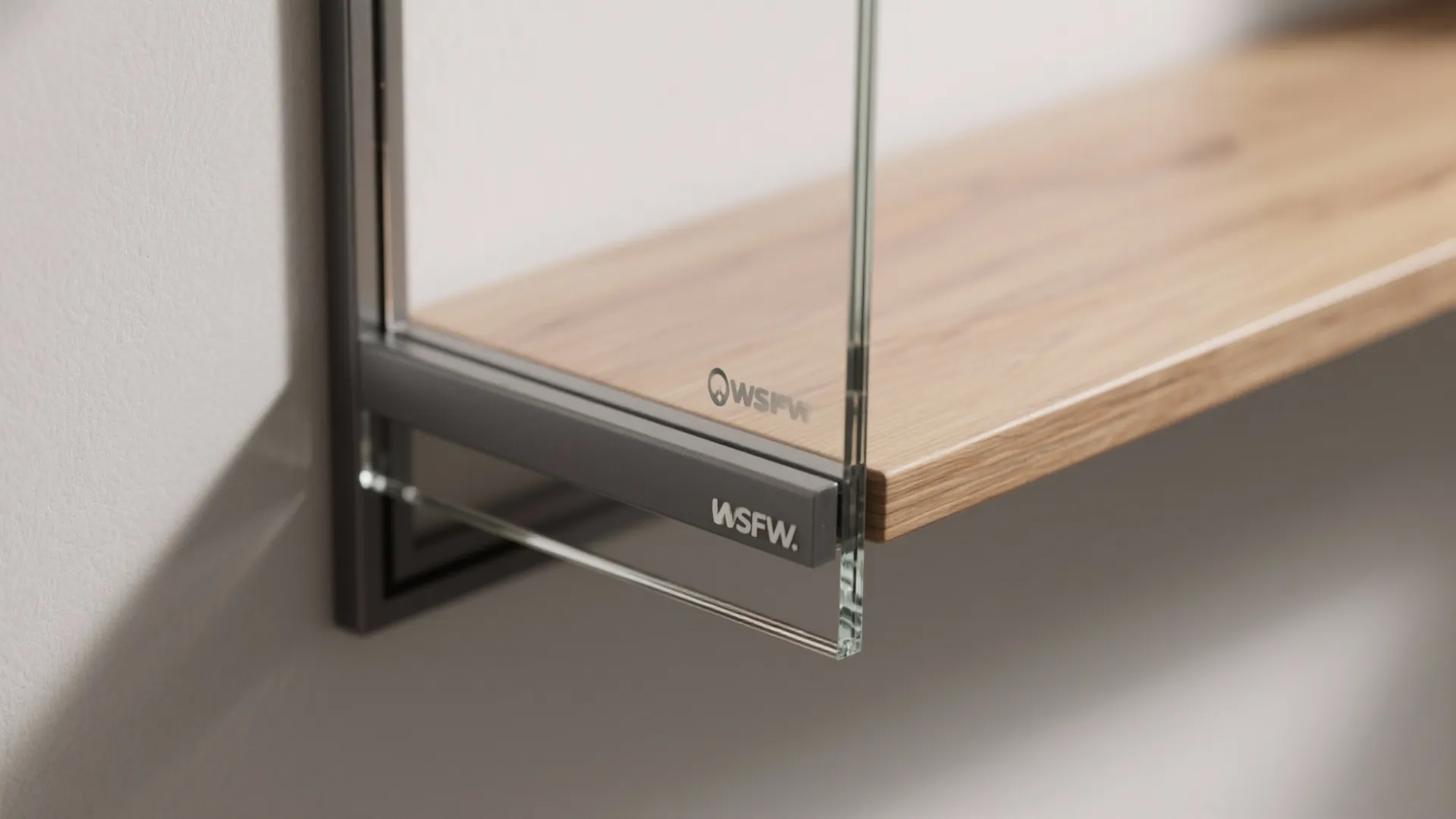 Close-up of low-iron glass and powder-coated frame on a partition shelf.