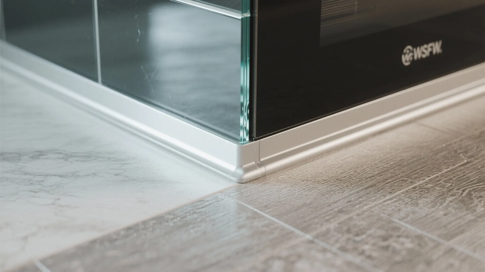 4) Light, Durable Surfaces: Glass Backsplash + Waterproof Floors