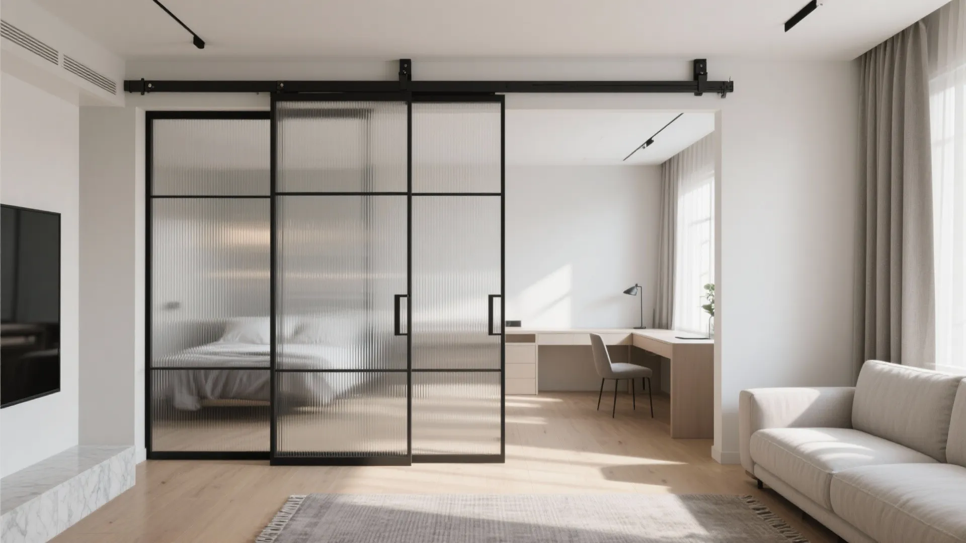 Modern apartment with black frame sliding glass doors separating a bedroom from the living room