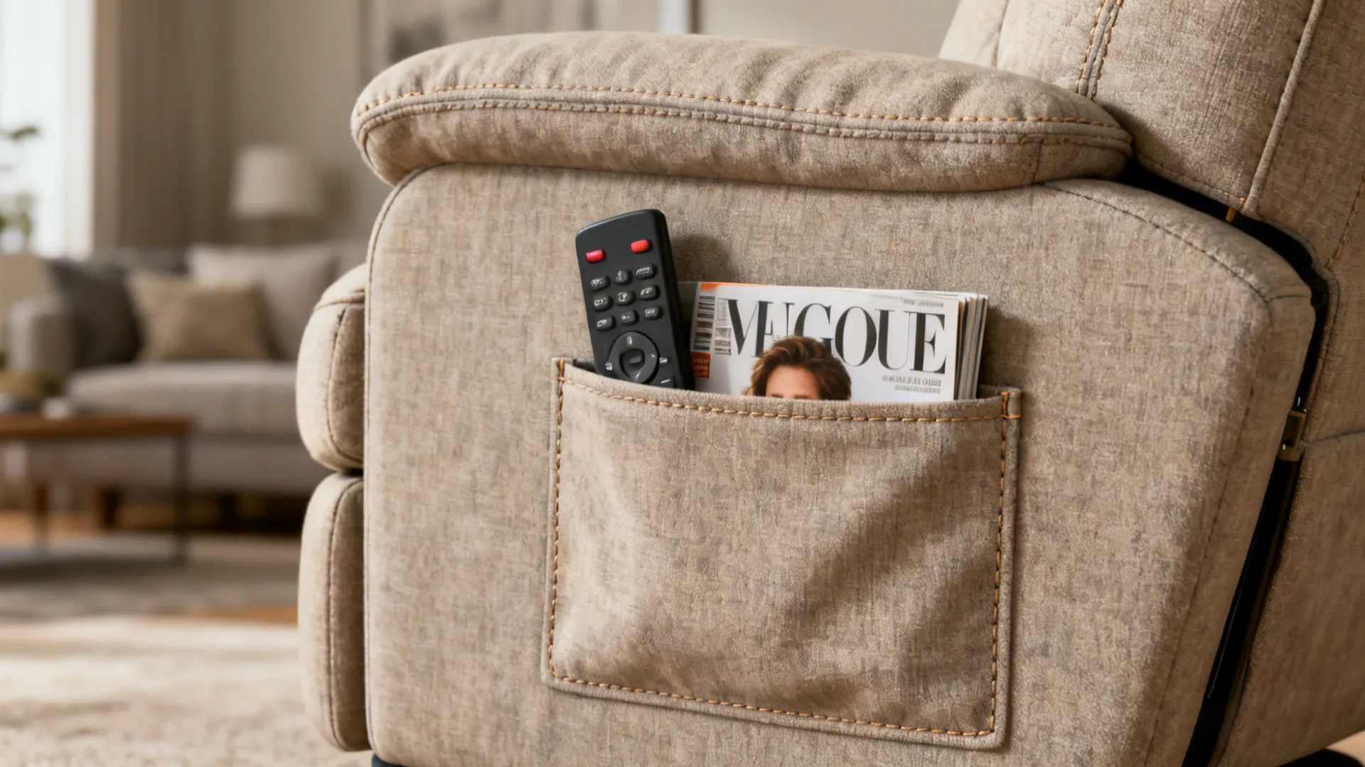 Close-up of a compact swivel glider's side storage pocket holding a remote and magazine.