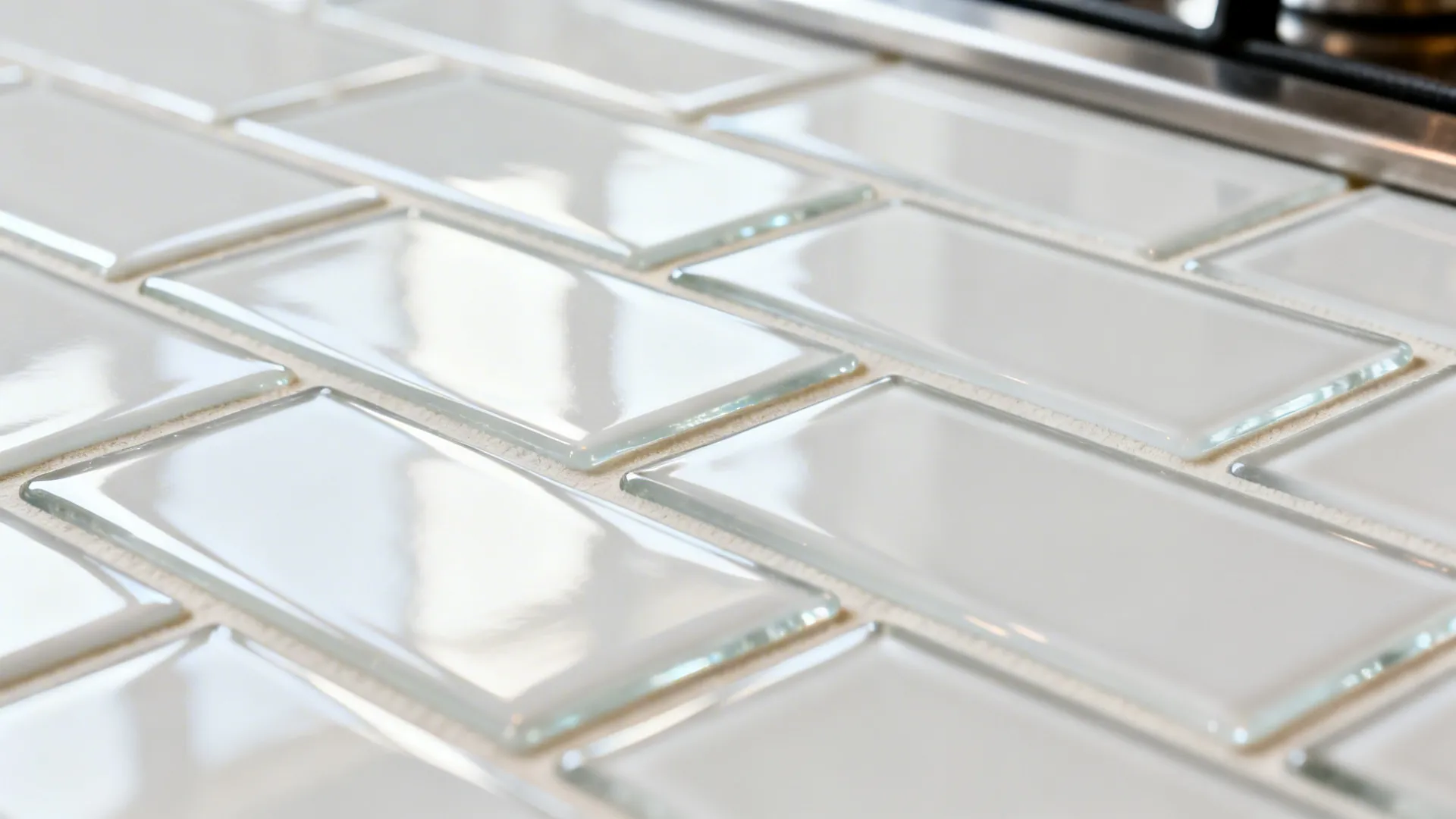 Macro of glossy white glass subway tiles with light grout and crisp reflections.