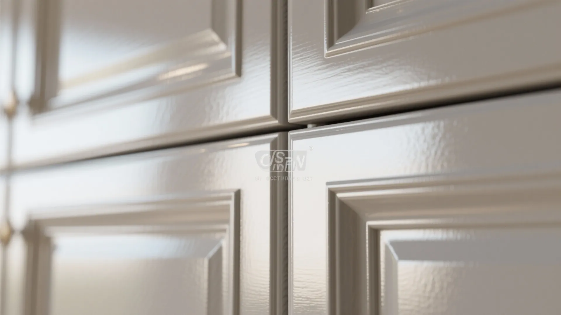 Close-up of high-gloss cabinet trim reflecting soft daylight, showing smooth professional finish.