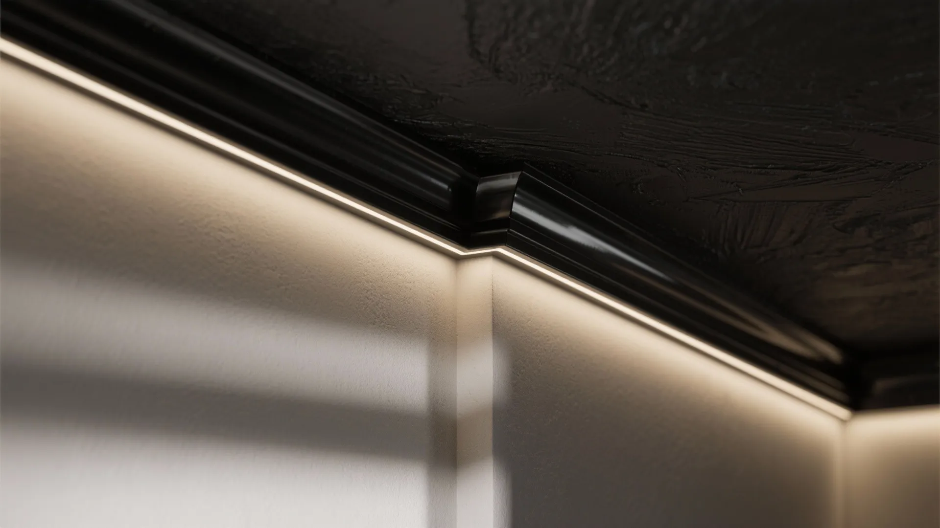 Black glossy wall trim with warm hidden light strips installed along a dark textured ceiling