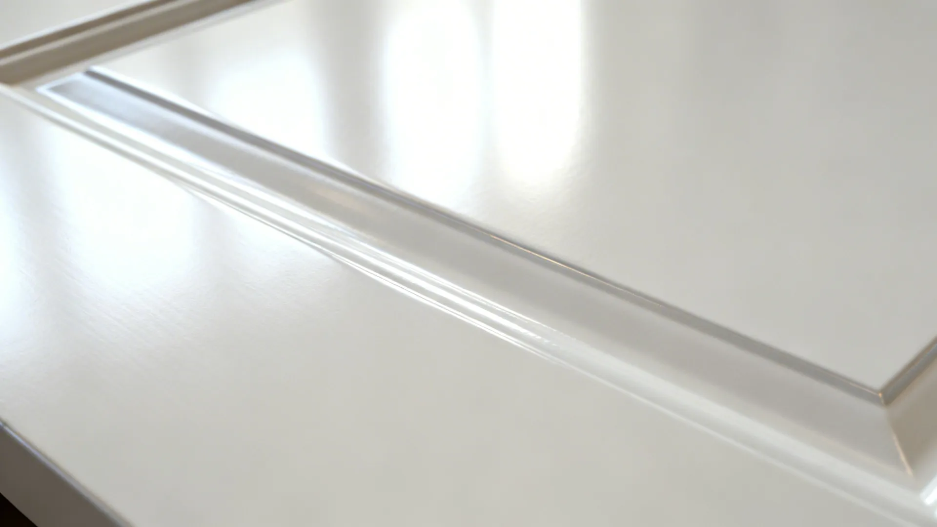 Macro of high-gloss white laminate with a thin shadowline reveal and clean reflections.