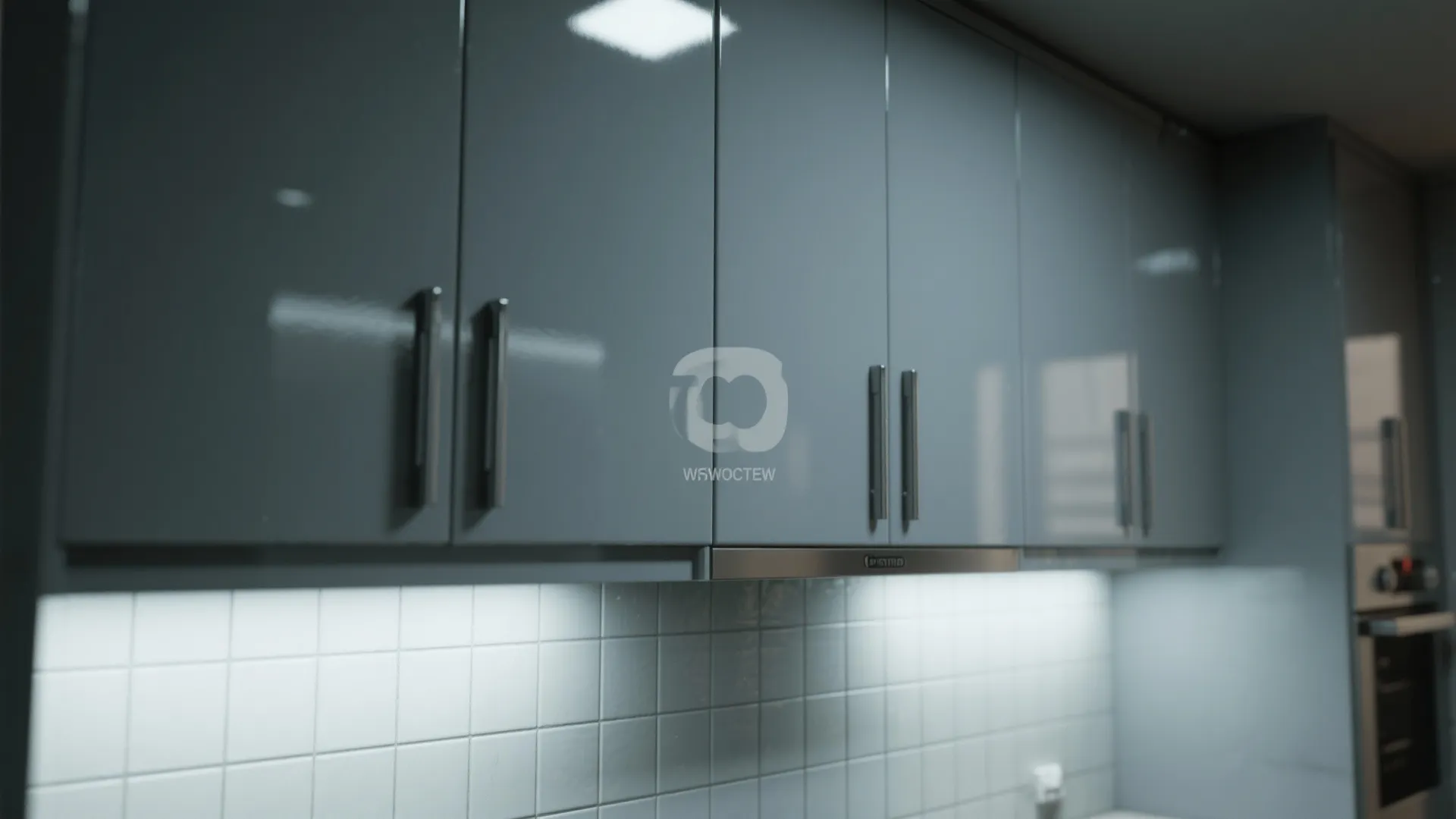 5. Gloss Grey Cabinets and Reflective Tiles for Light Bounce