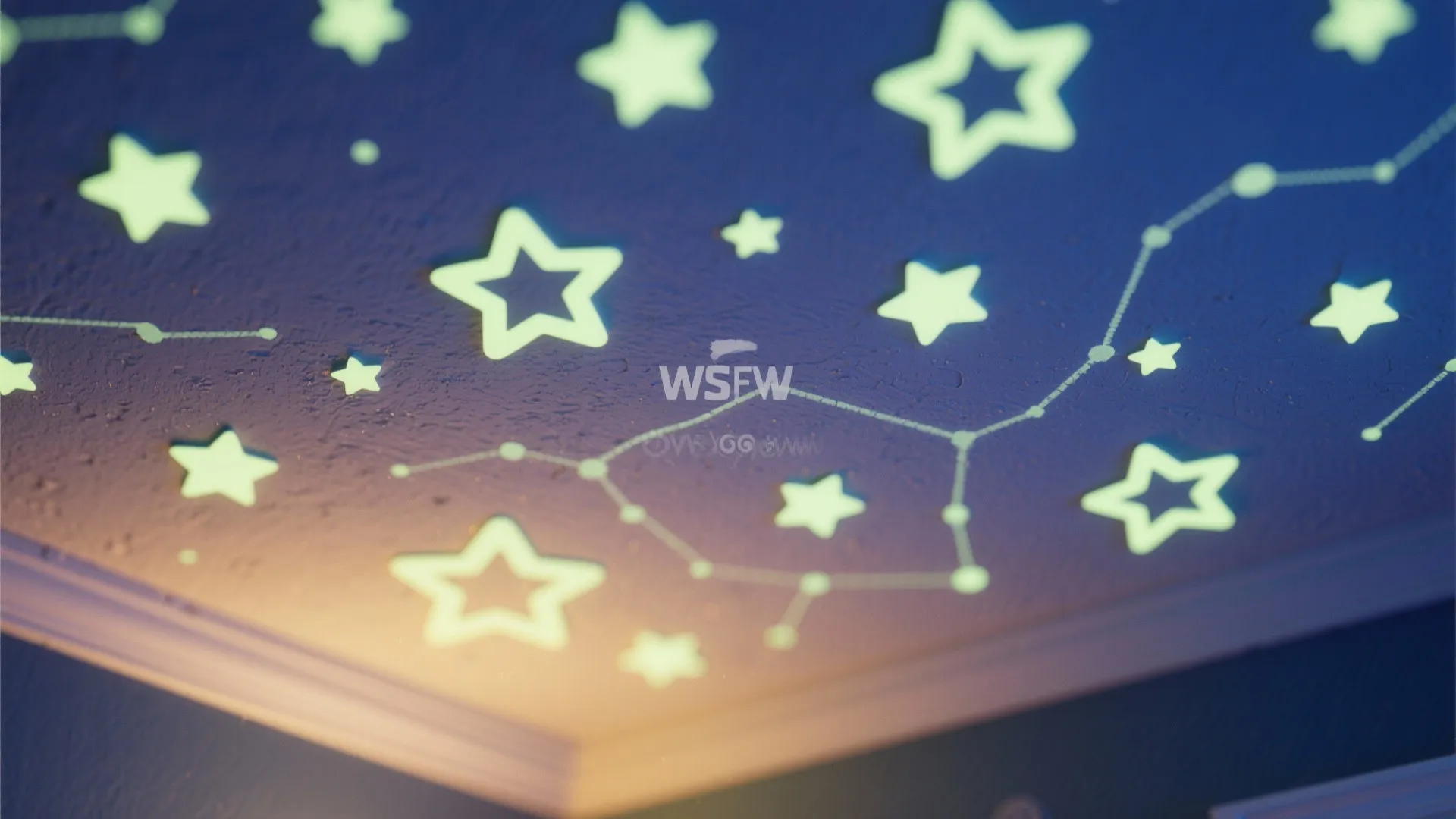 Glow in the dark star stickers and constellation lines on a dark blue bedroom ceiling