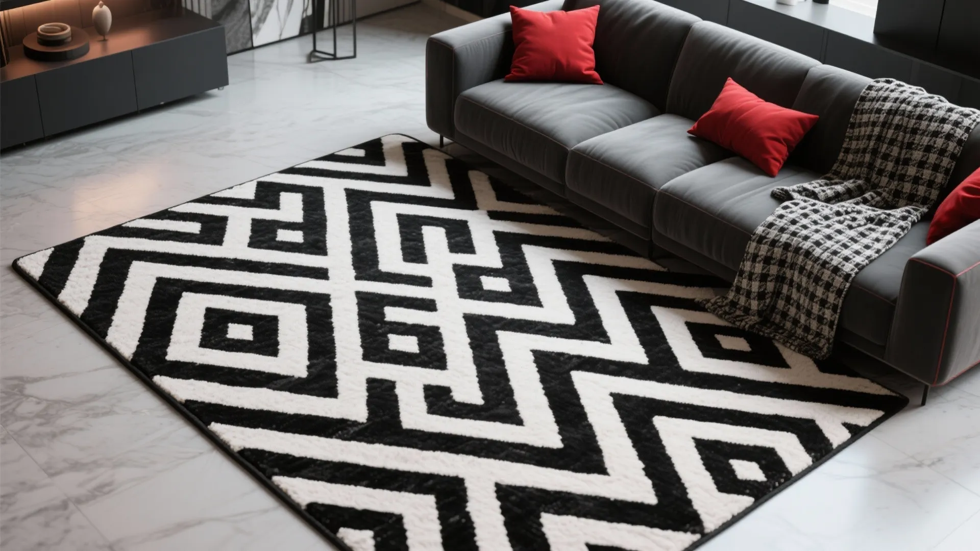 Black and white patterned rug placed on marble floor next to a dark grey leather sofa