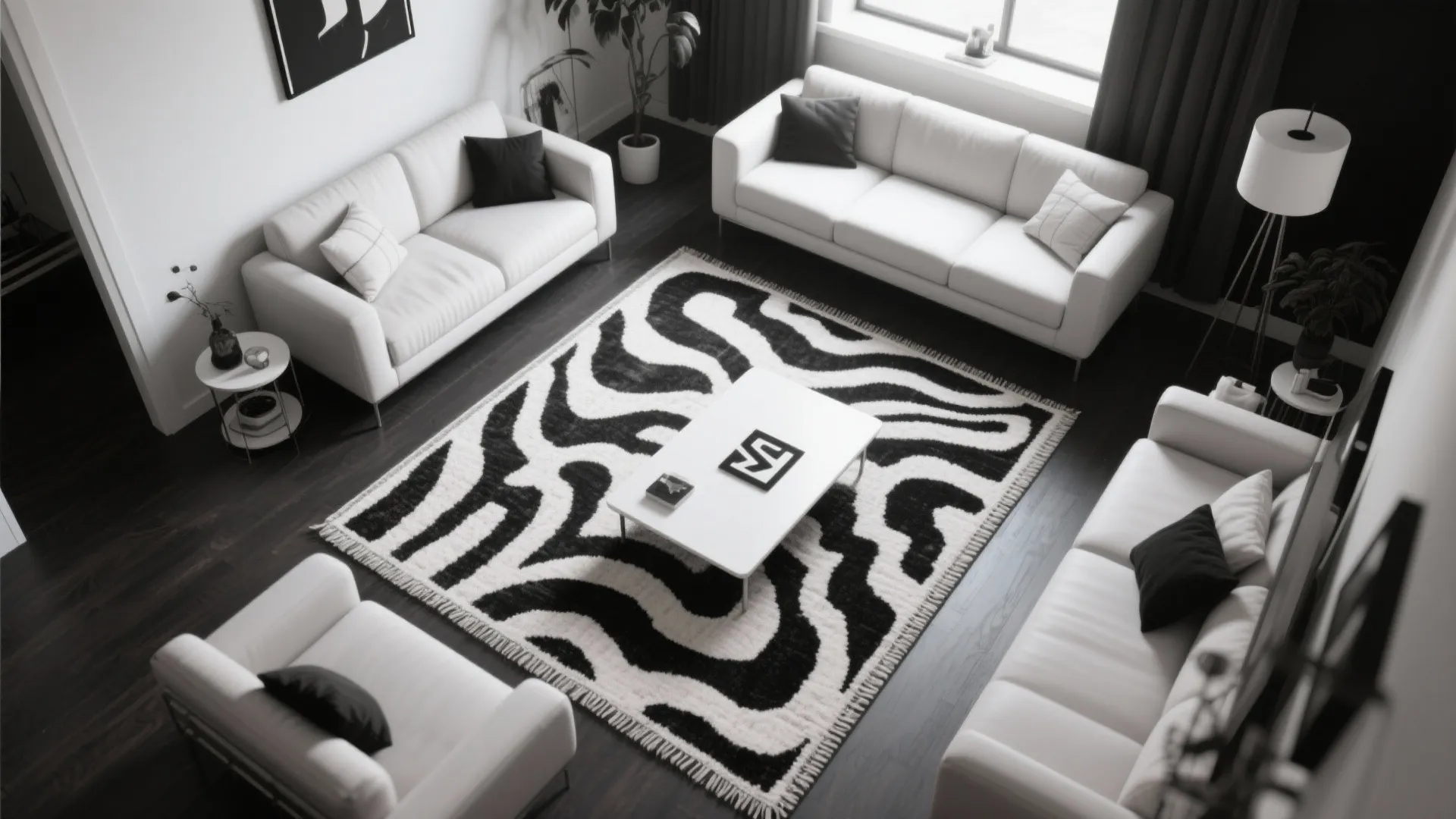 Top view of living room with white sofas black and white pattern rug and coffee table