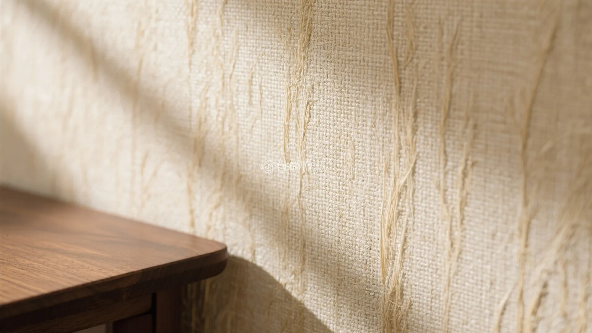 Close-up of beige grasscloth wallpaper texture in home office