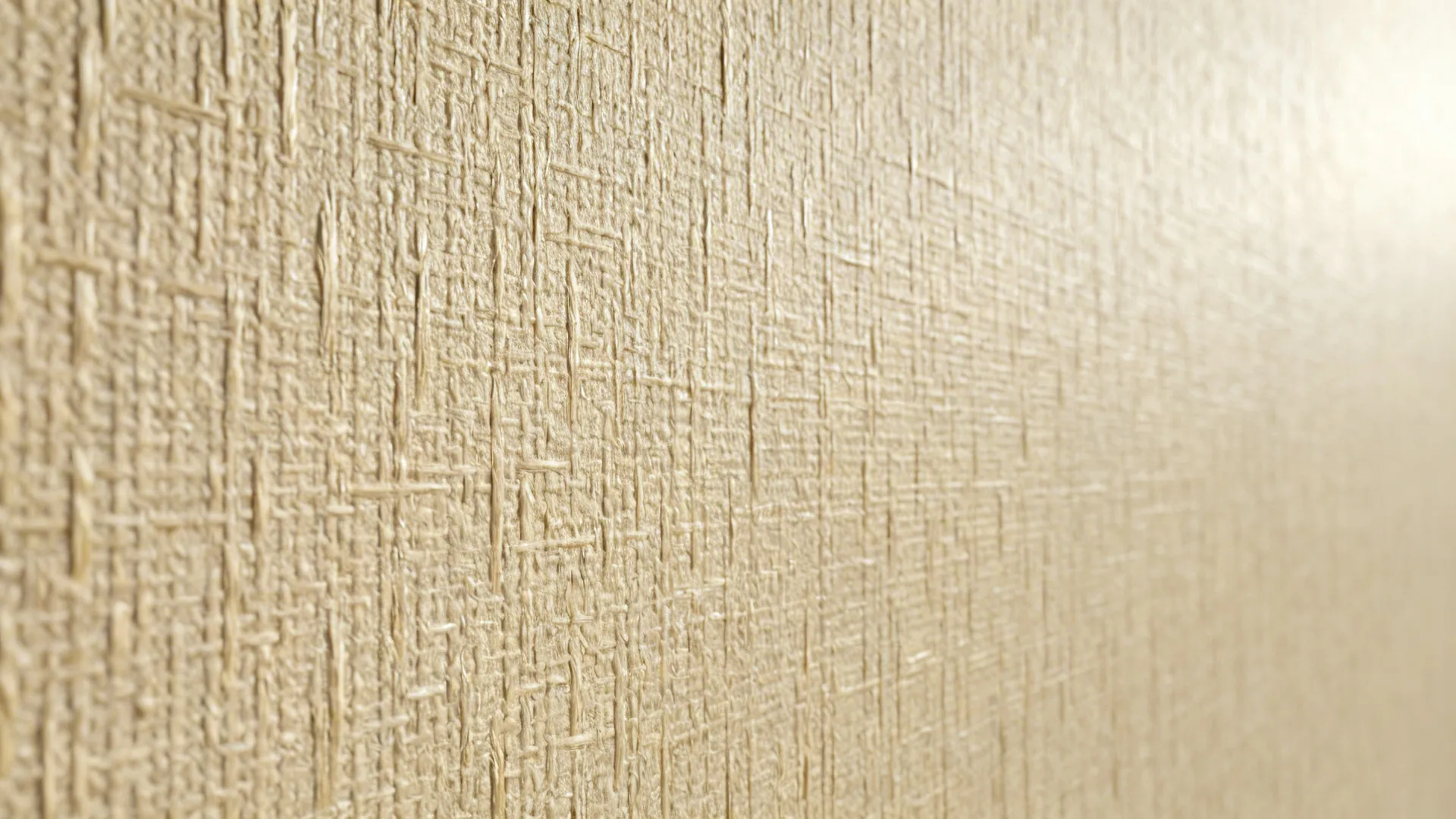 Close-up of grasscloth wallpaper texture showing natural fibers and weave