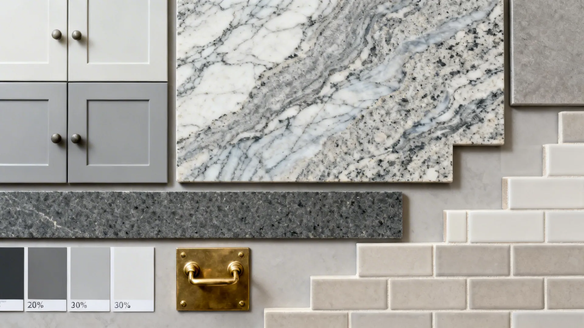 Flat lay of light-to-dark gray swatches with mid-gray granite, Kota stone, and brass hardware.